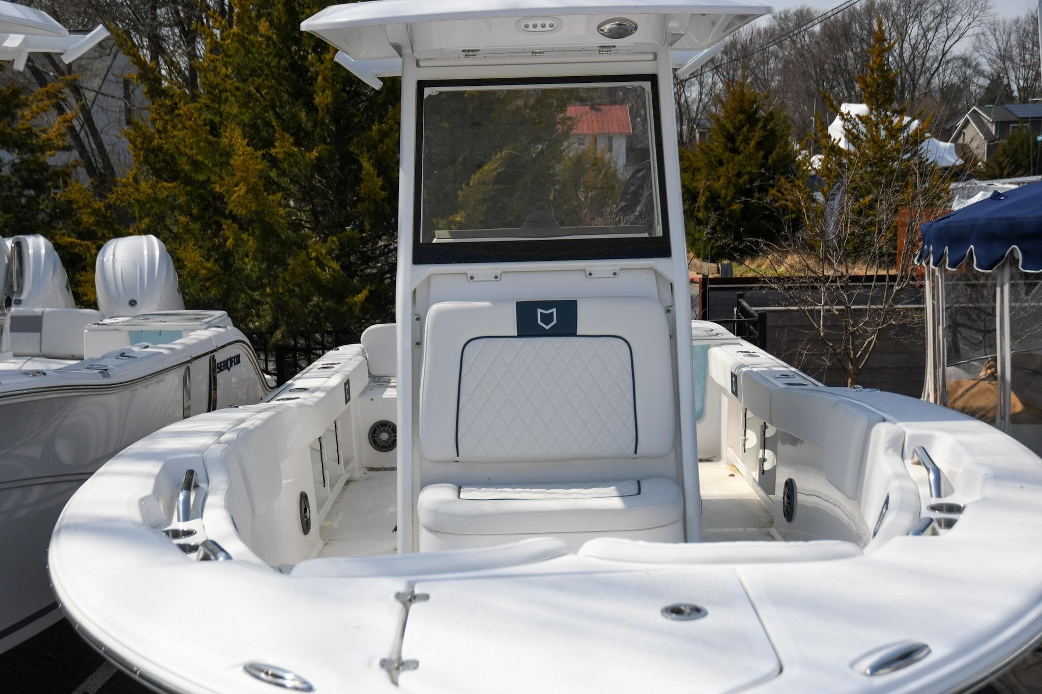 2026 Sea Fox 248 Commander boat, white interior, center console, outdoor setting.