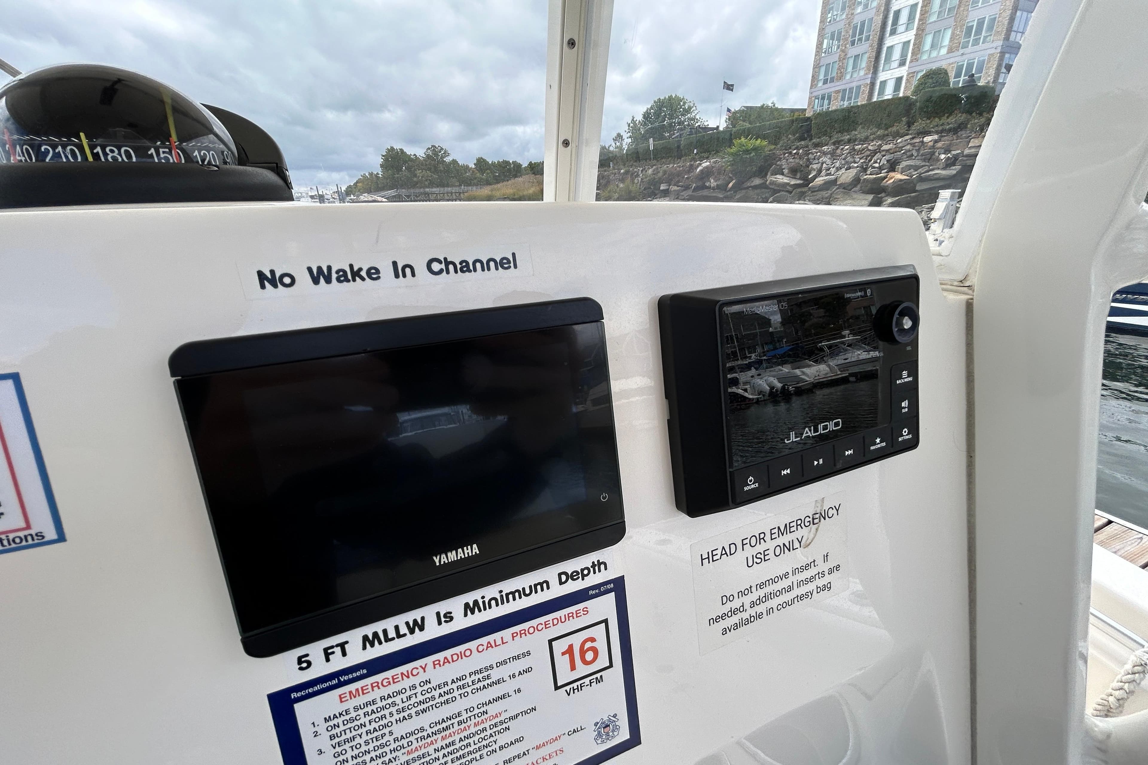 2023 Cobia 240 Center Console dashboard with Yamaha and JL Audio displays.