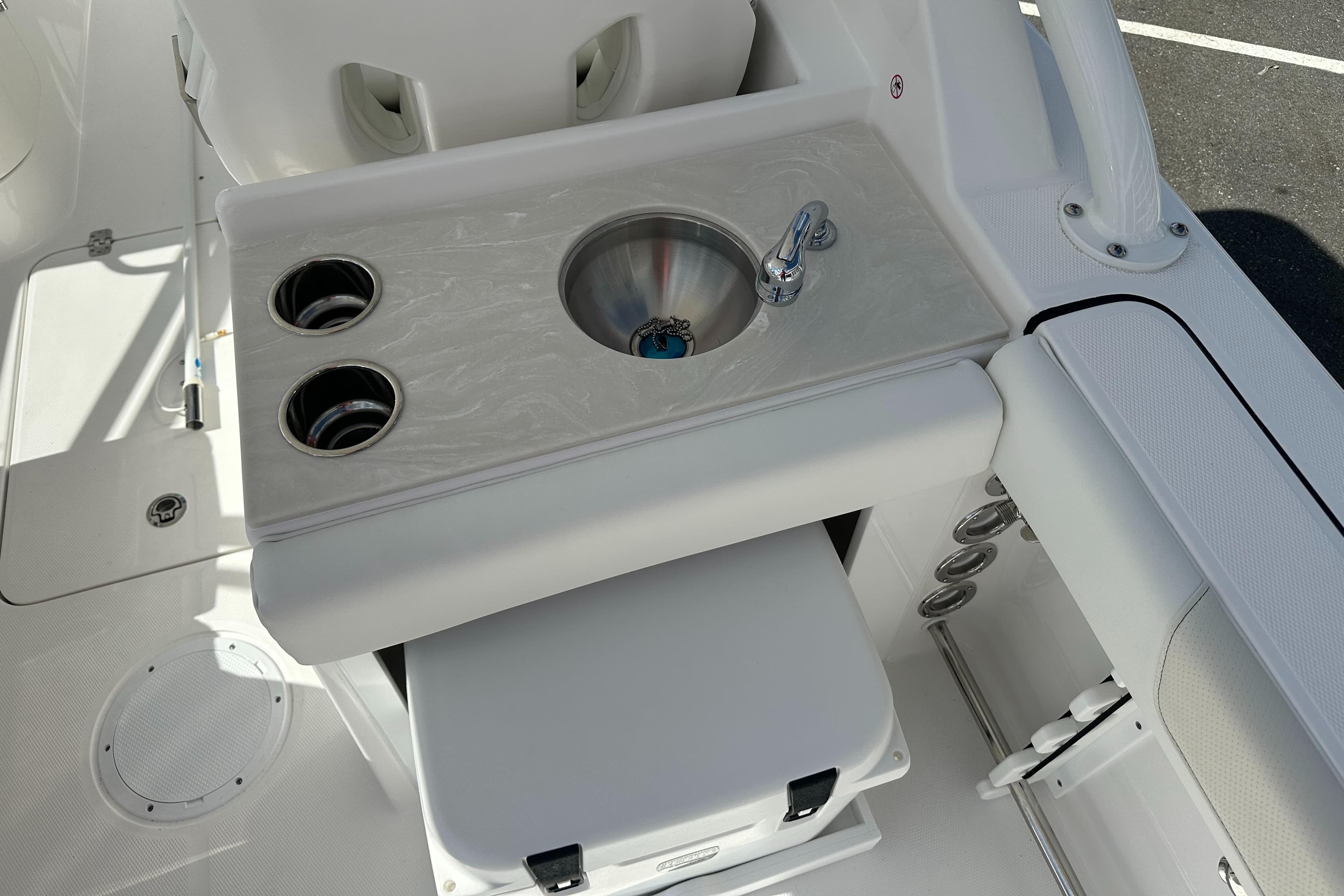 2025 Edgewater 248CX Crossover boat interior with sink and cup holders.