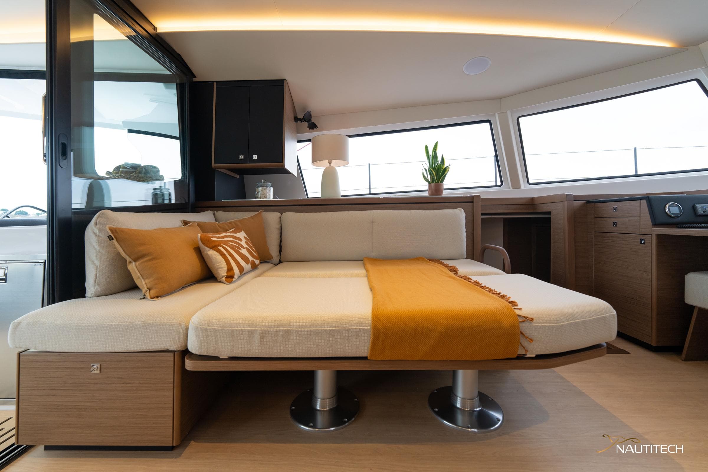 Luxurious interior of 2025 Nautitech 48 Open catamaran with modern seating and decor.