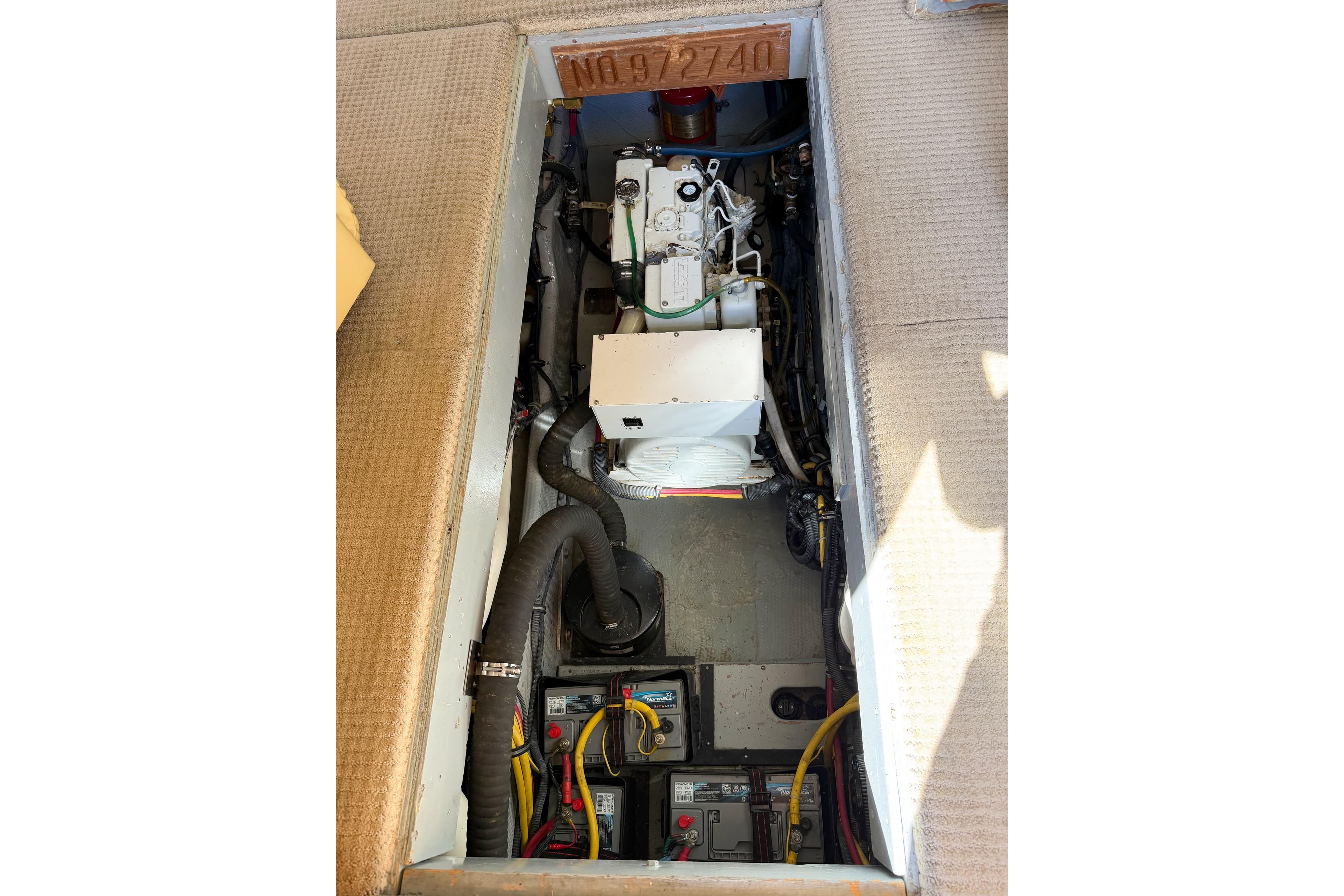 Engine compartment of a 1988 Pacemaker 36 Convertible boat, showing mechanical components.