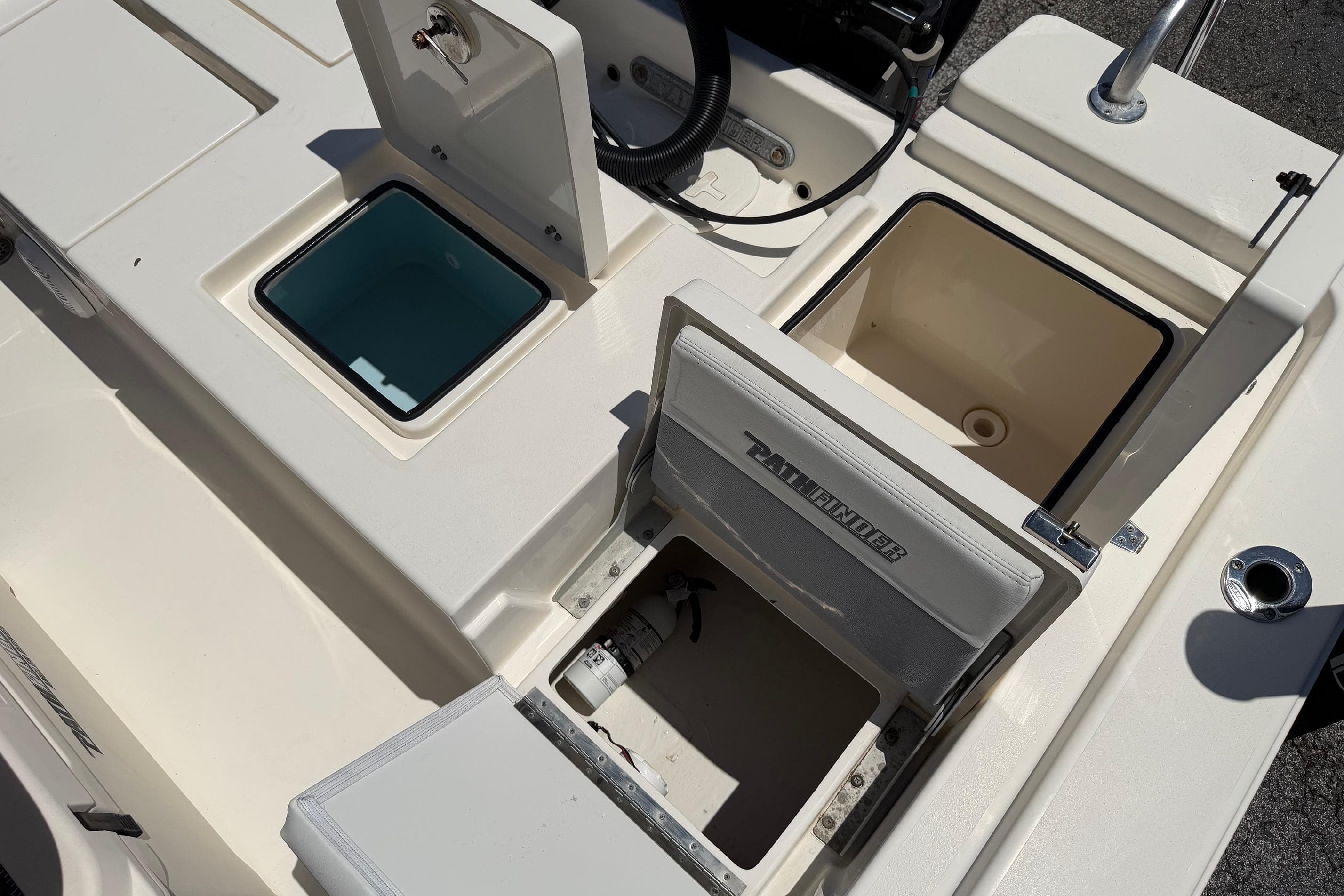 2021 Pathfinder 2200 TRS boat interior with open storage compartments and seating.