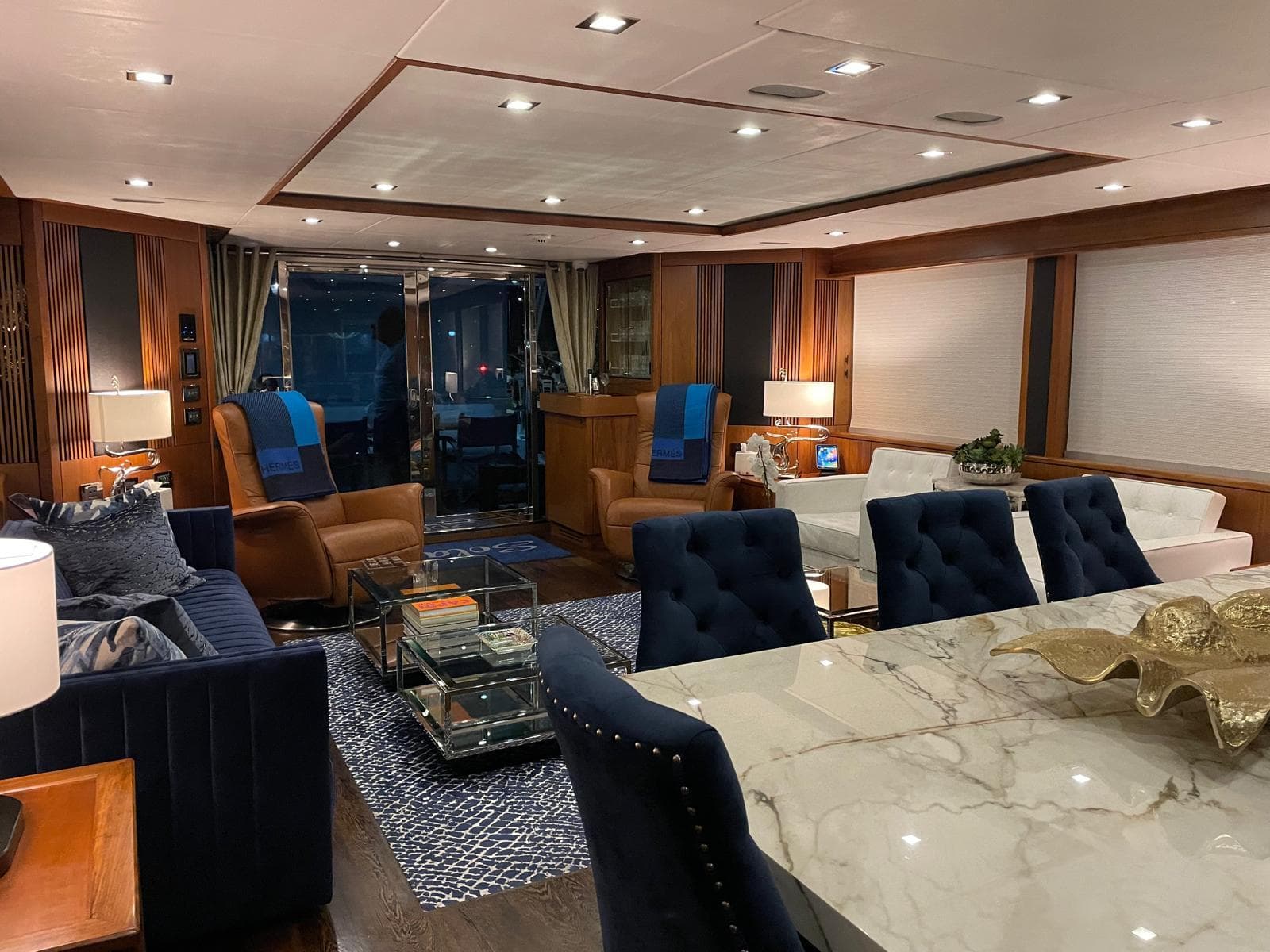 Luxurious interior of 2012 Sunseeker 30 Metre Yacht with elegant seating and marble table.