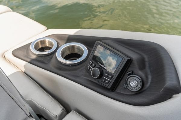 2023 Bennington QX 25 QXSBA boat console with cup holders and control panel.