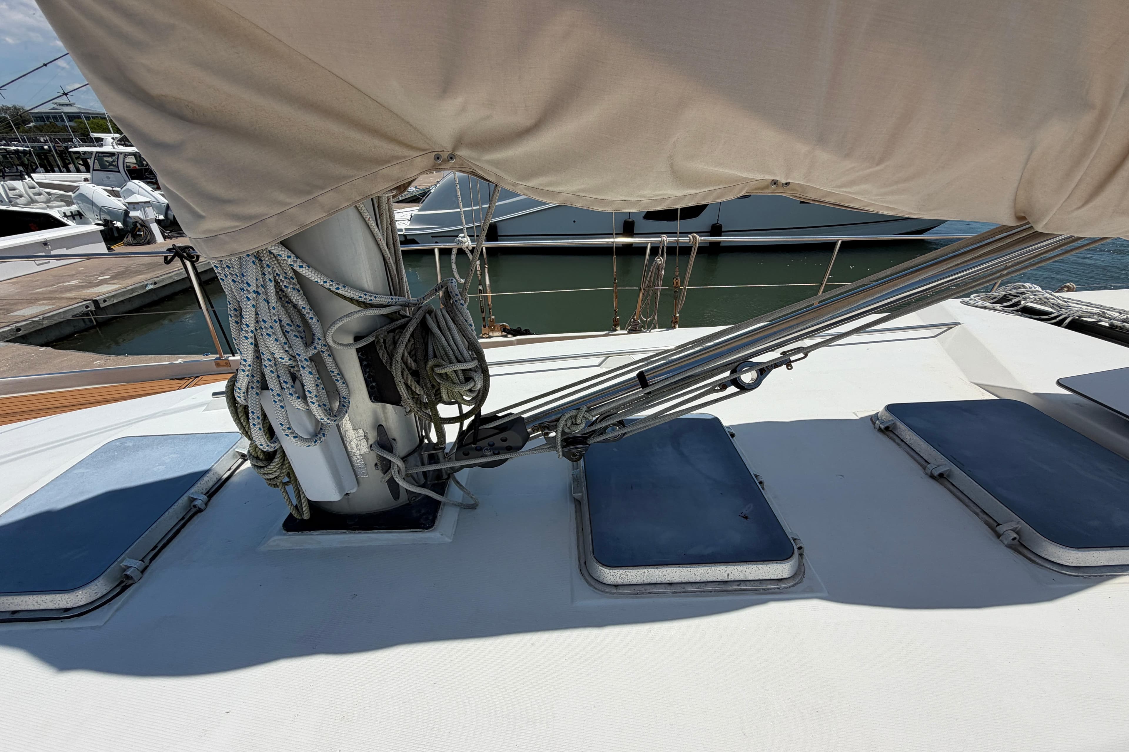 Deck view of 1980 Amel Mango 52 sailboat with rigging and hatches.