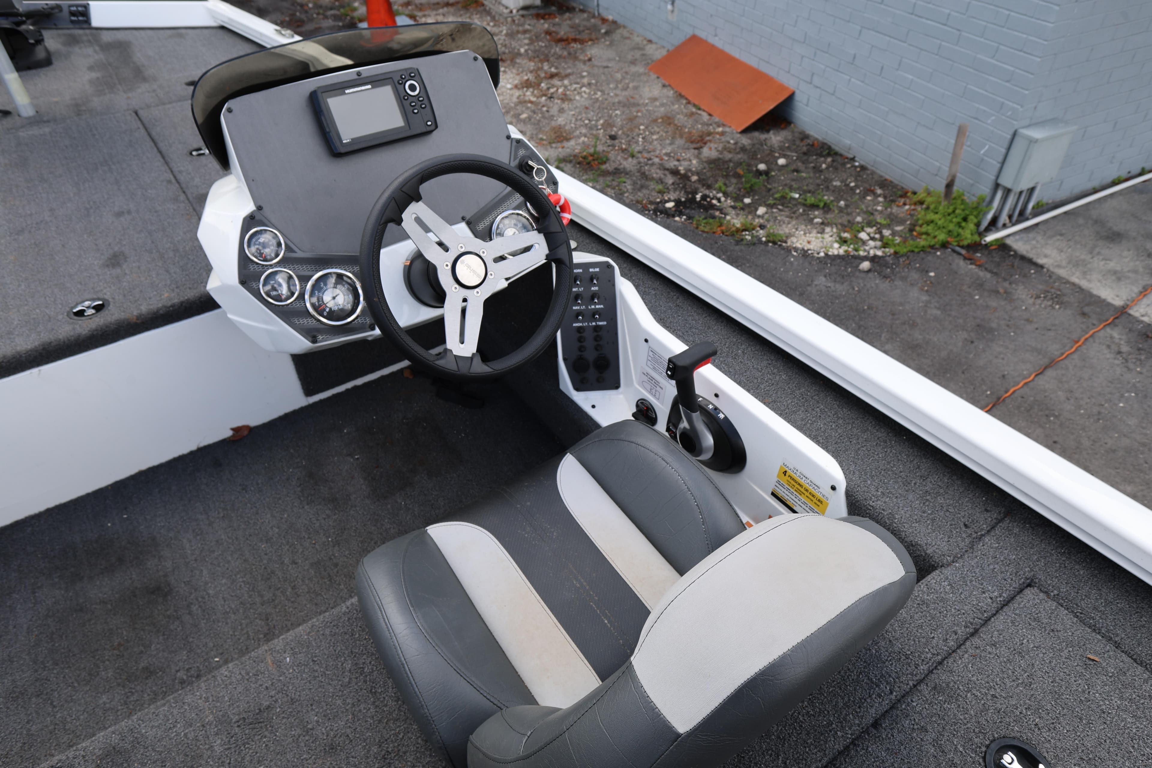 2023 Vexus AVX189 boat cockpit with steering wheel and control panel.