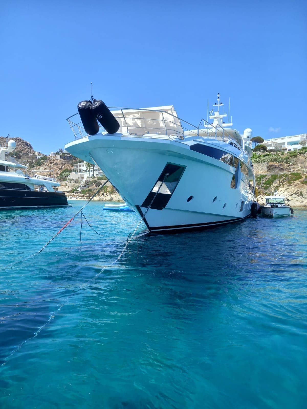 Luxury Azimut Grande 35 Metri yacht anchored in clear blue waters, 2020 model.