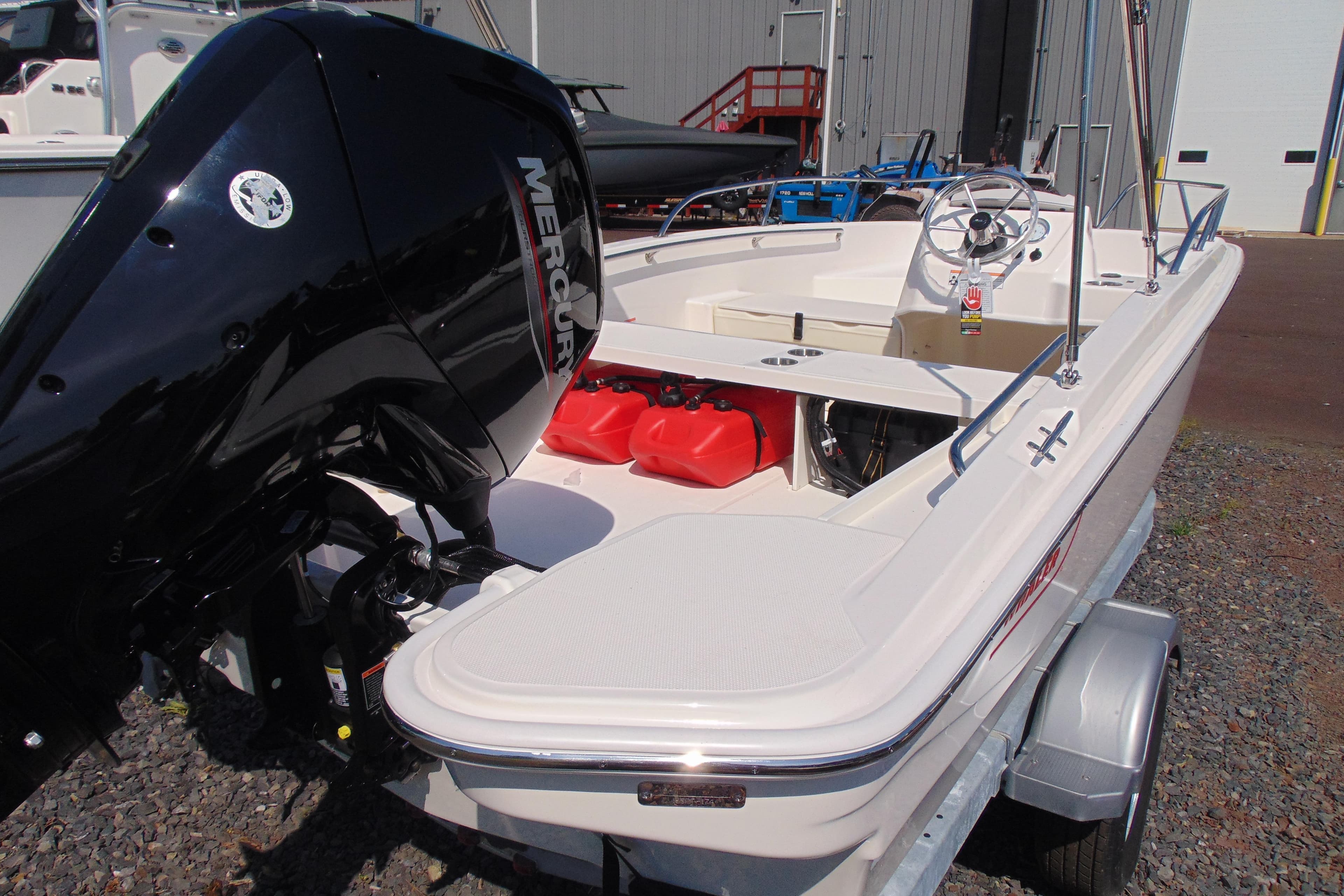 2026 Boston Whaler 160 Super Sport boat with Mercury engine on trailer.