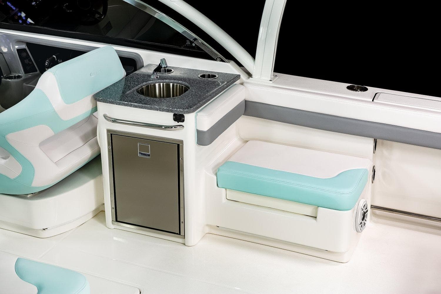 Manufacturer Provided Image: 2025 Robalo R317 Dual Console interior with sink and seating area.