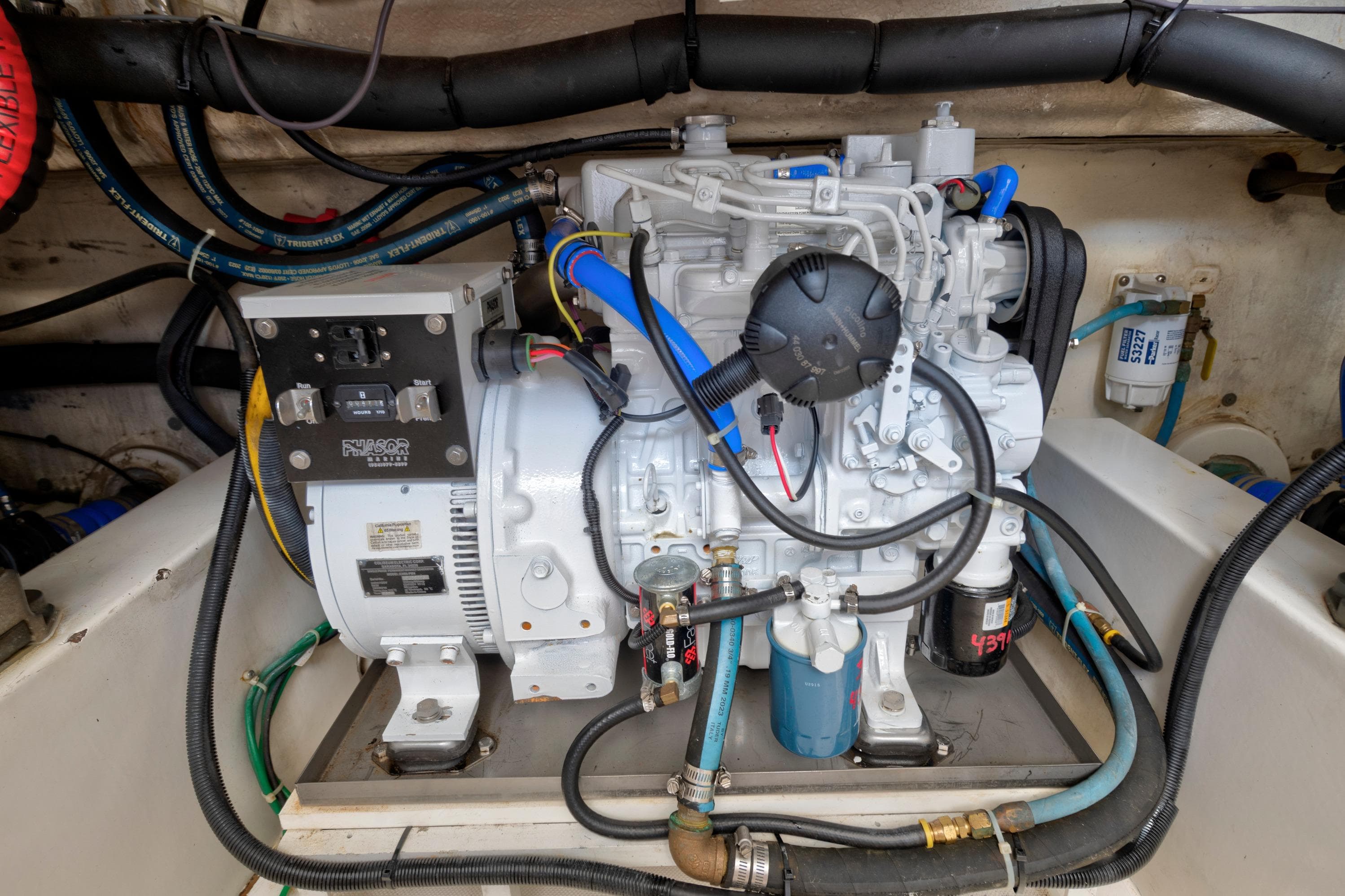 Engine compartment of a 2008 Ocean Yacht 37 Billfish, showcasing detailed mechanical components.