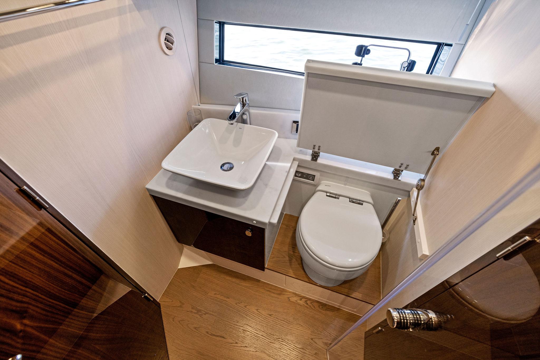 Luxurious bathroom in 2025 Fairline Targa 50 GT yacht with modern sink and toilet.