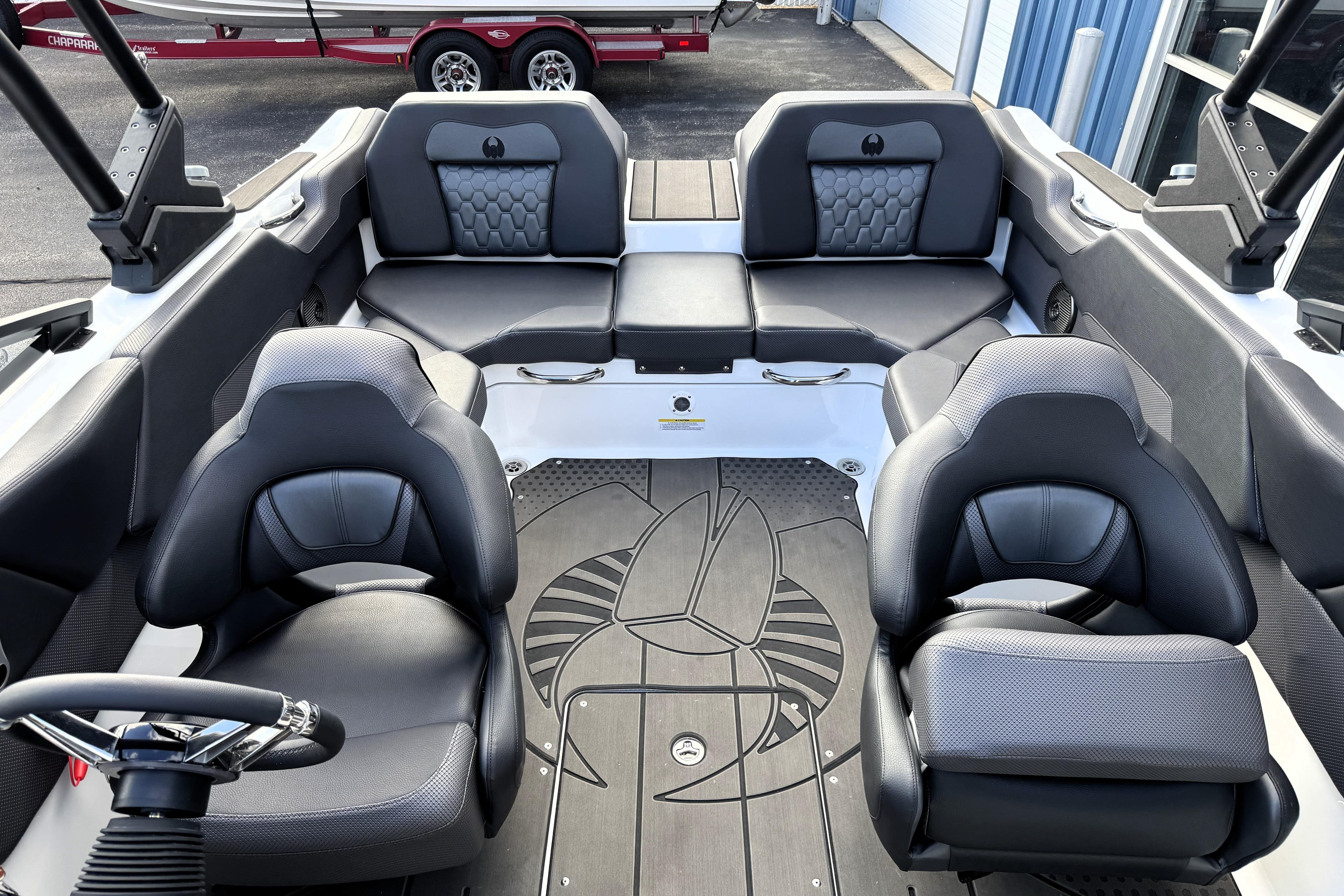 Interior of 2026 Scarab 210 LX boat with modern seating and sleek design.