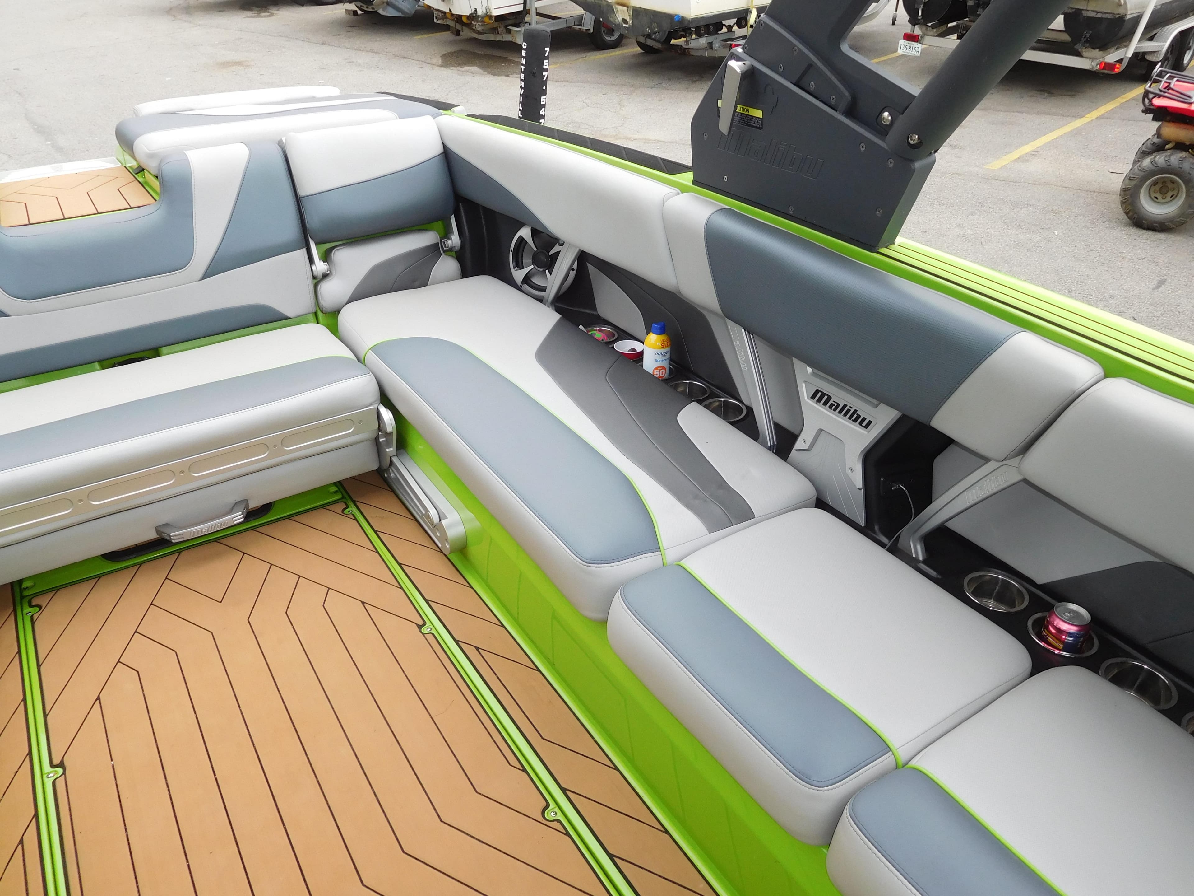 2017 Malibu Wakesetter 24 MXZ interior with gray and green seating.