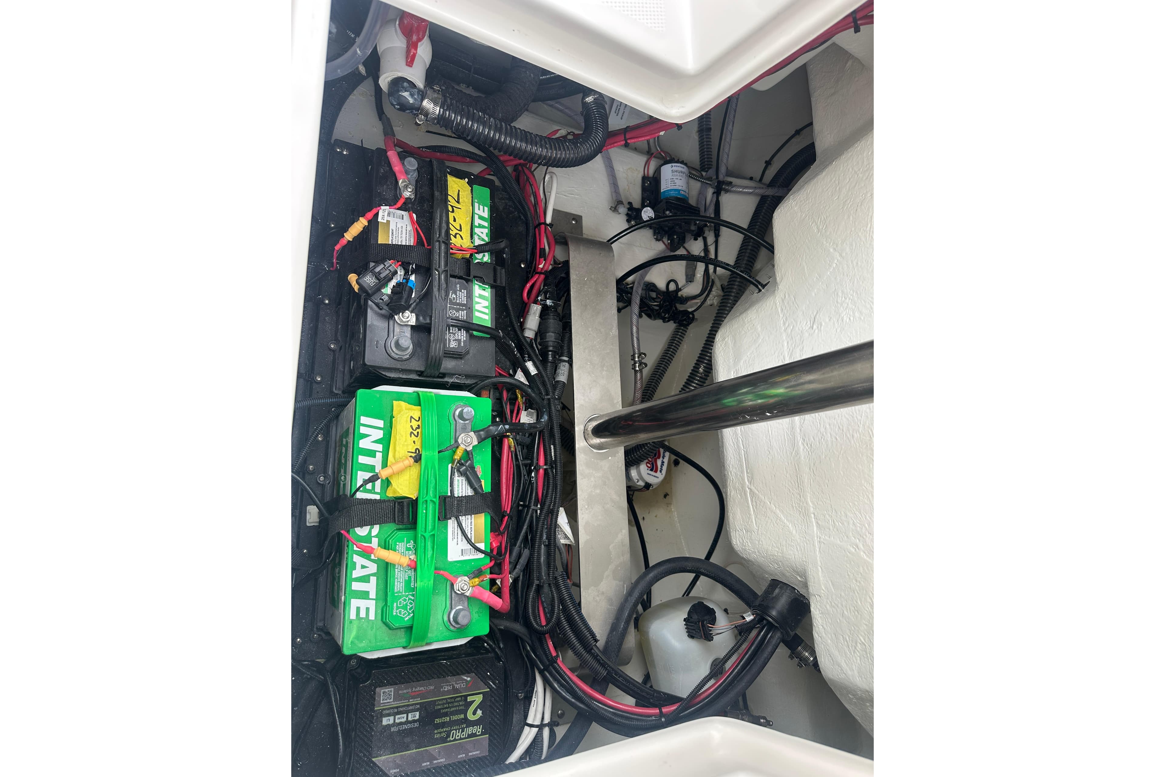 Battery compartment of 2026 Sailfish 232 CC boat with Interstate batteries and wiring.