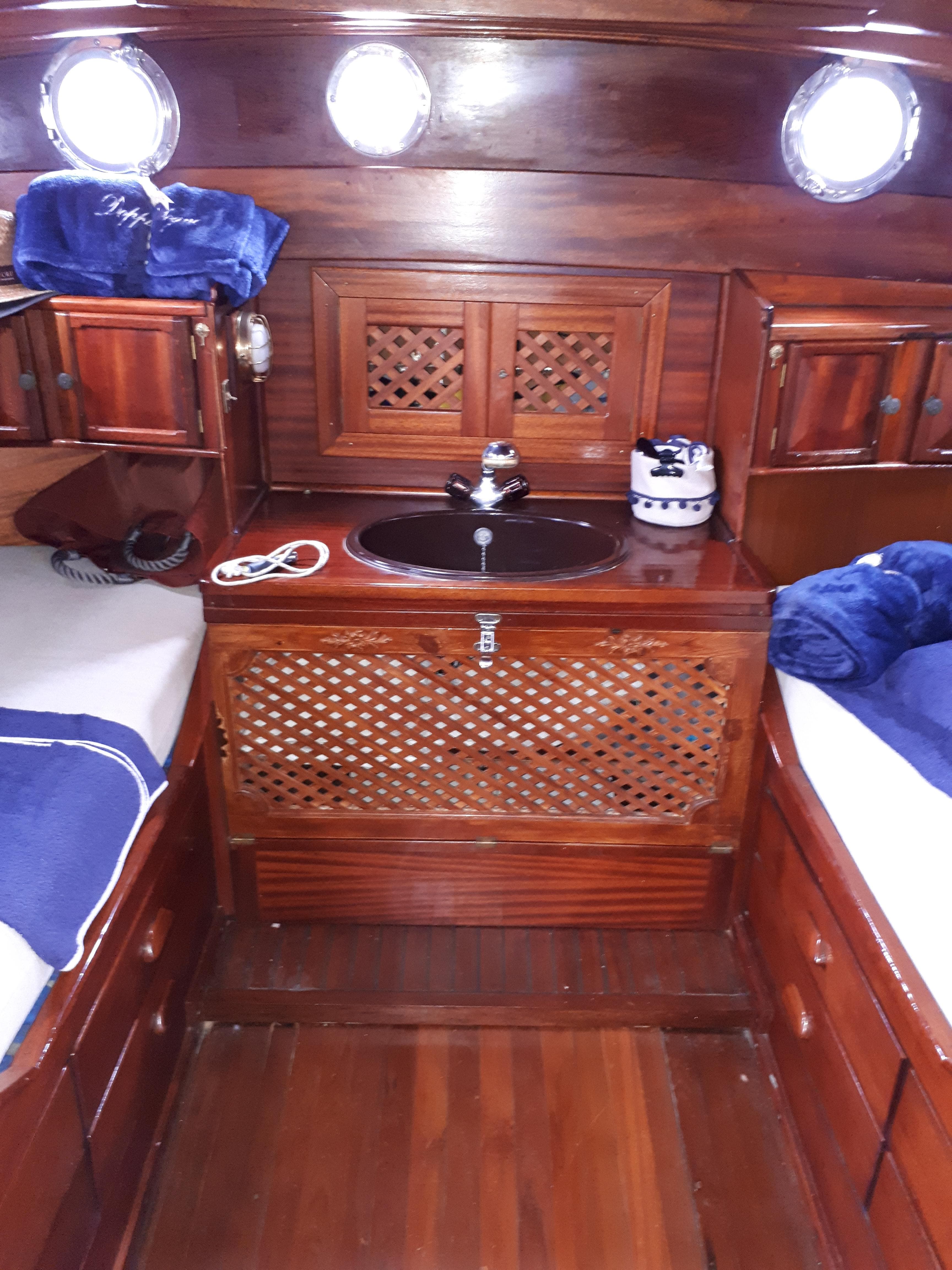 1956 Sangermani Motorsailer cabin interior with wooden finish and twin beds.