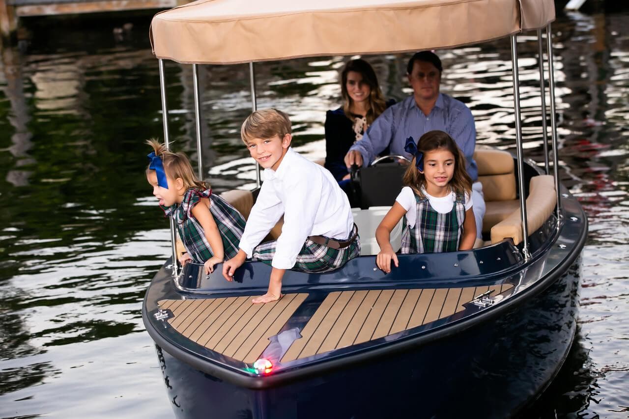 Family enjoying a ride on the 2023 Vision Marine Technologies Fantail 217 boat.