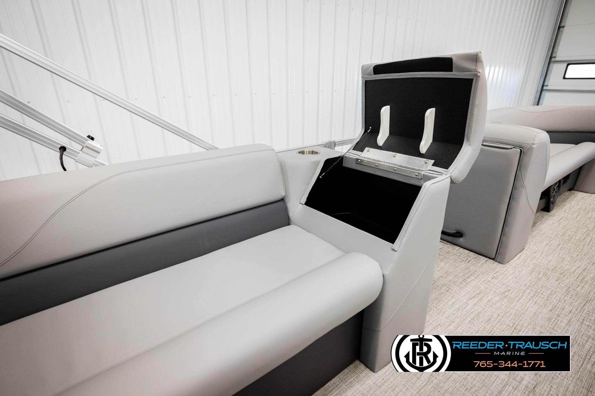 2026 Avalon VLS QL boat interior with open storage compartment and sleek seating design.