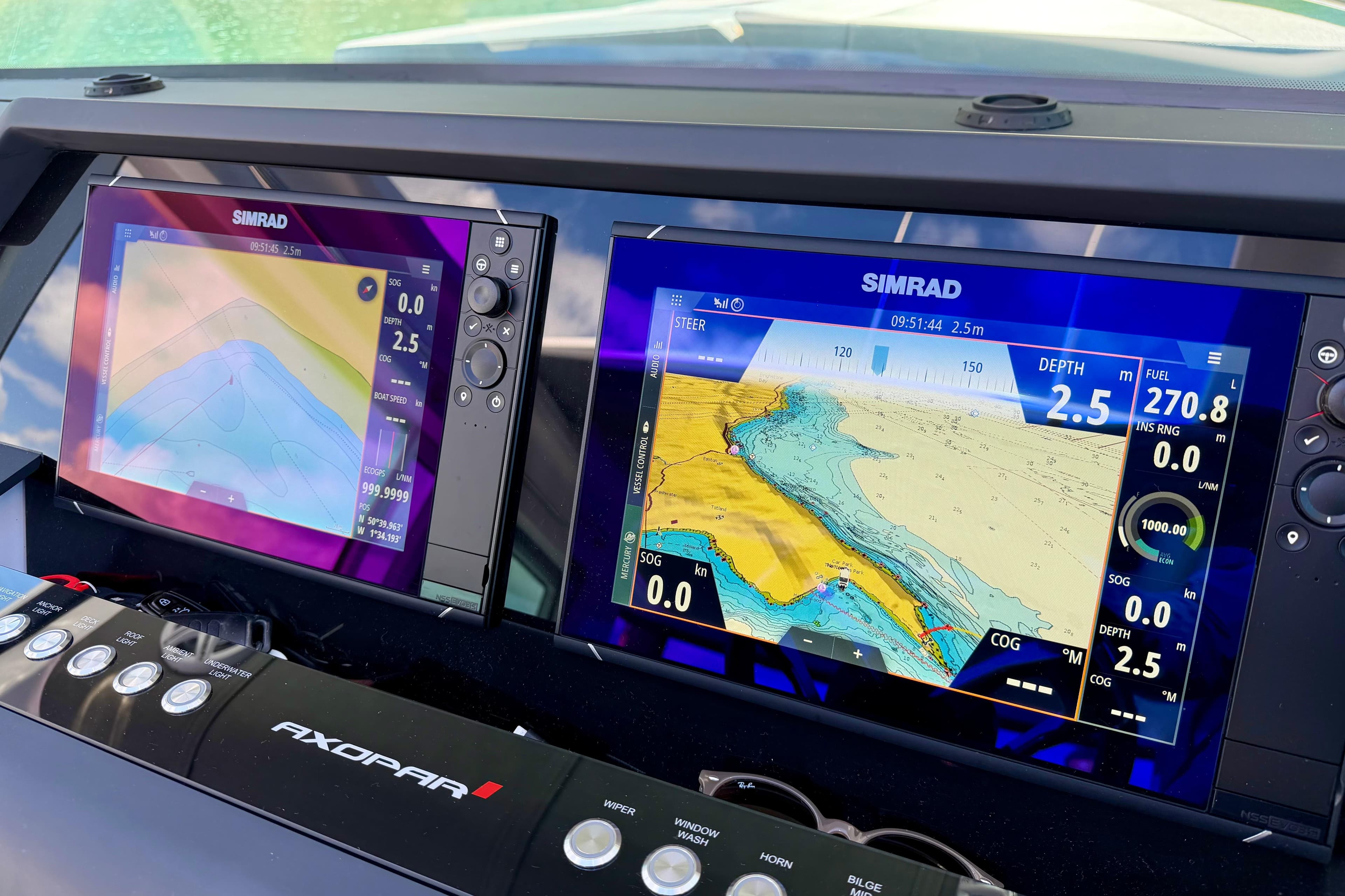 Simrad navigation displays on 2024 Axopar 37 XC Cross Cabin boat dashboard.