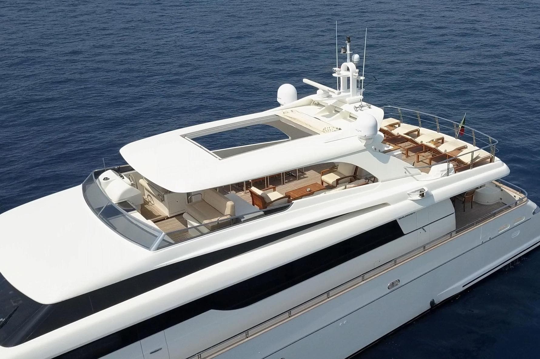 Luxurious 2007 Sanlorenzo SL108 yacht cruising on open sea, showcasing elegant design and spacious deck.