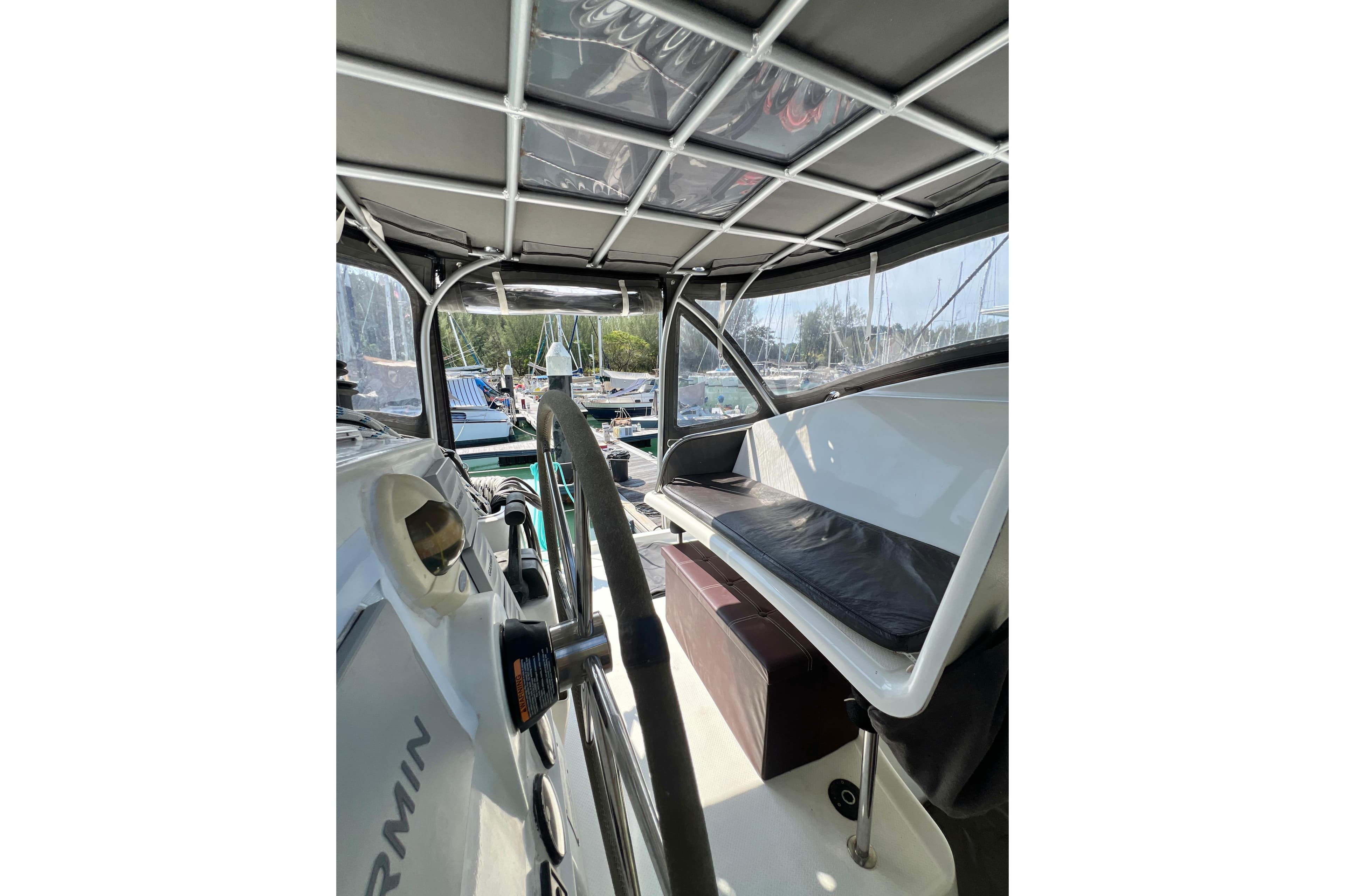 Interior view of a 2009 Fountaine Pajot Lipari 41 catamaran, featuring helm and seating area.
