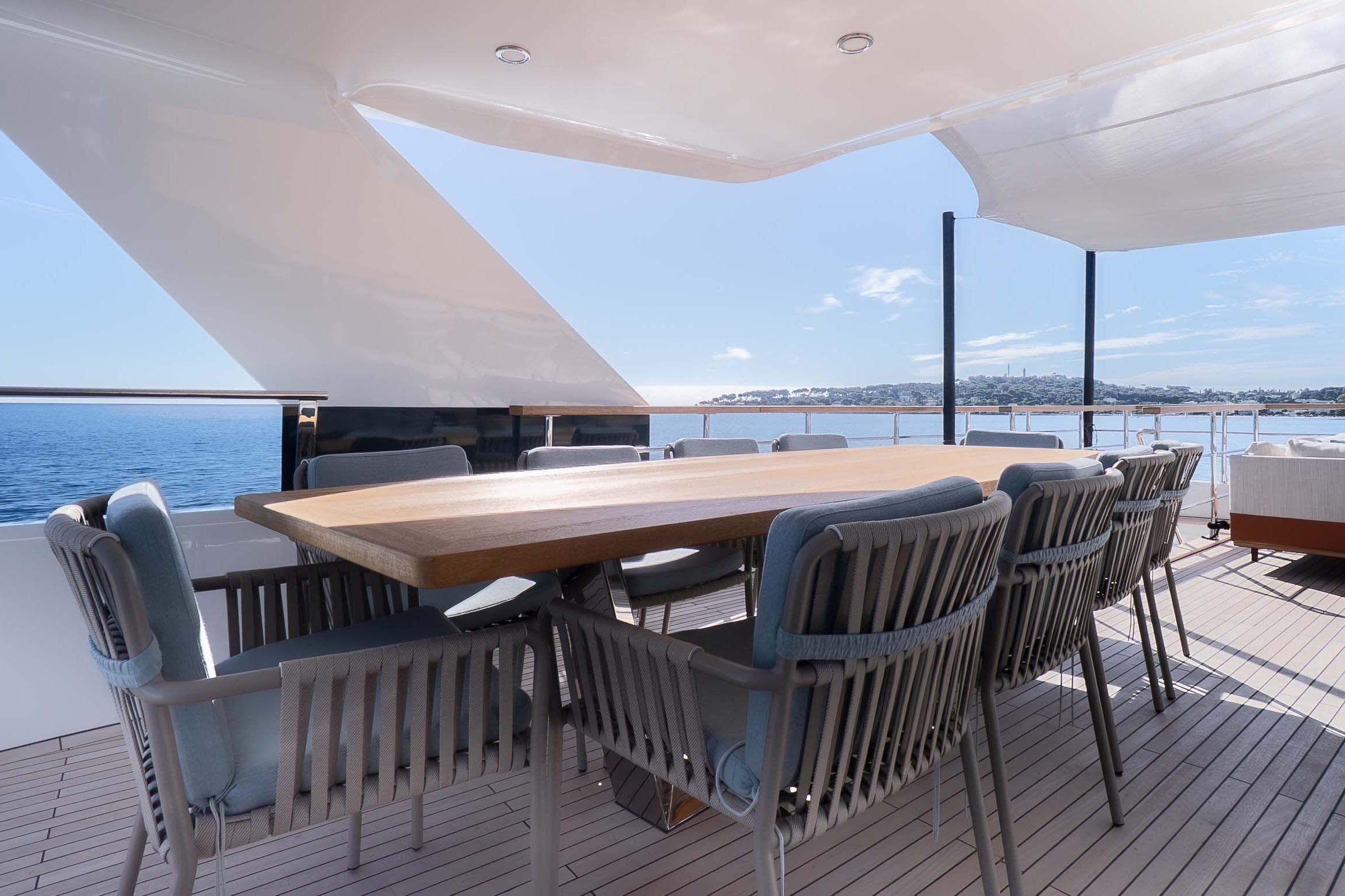 Luxury outdoor dining area on 2025 Numarine 32 XP yacht
