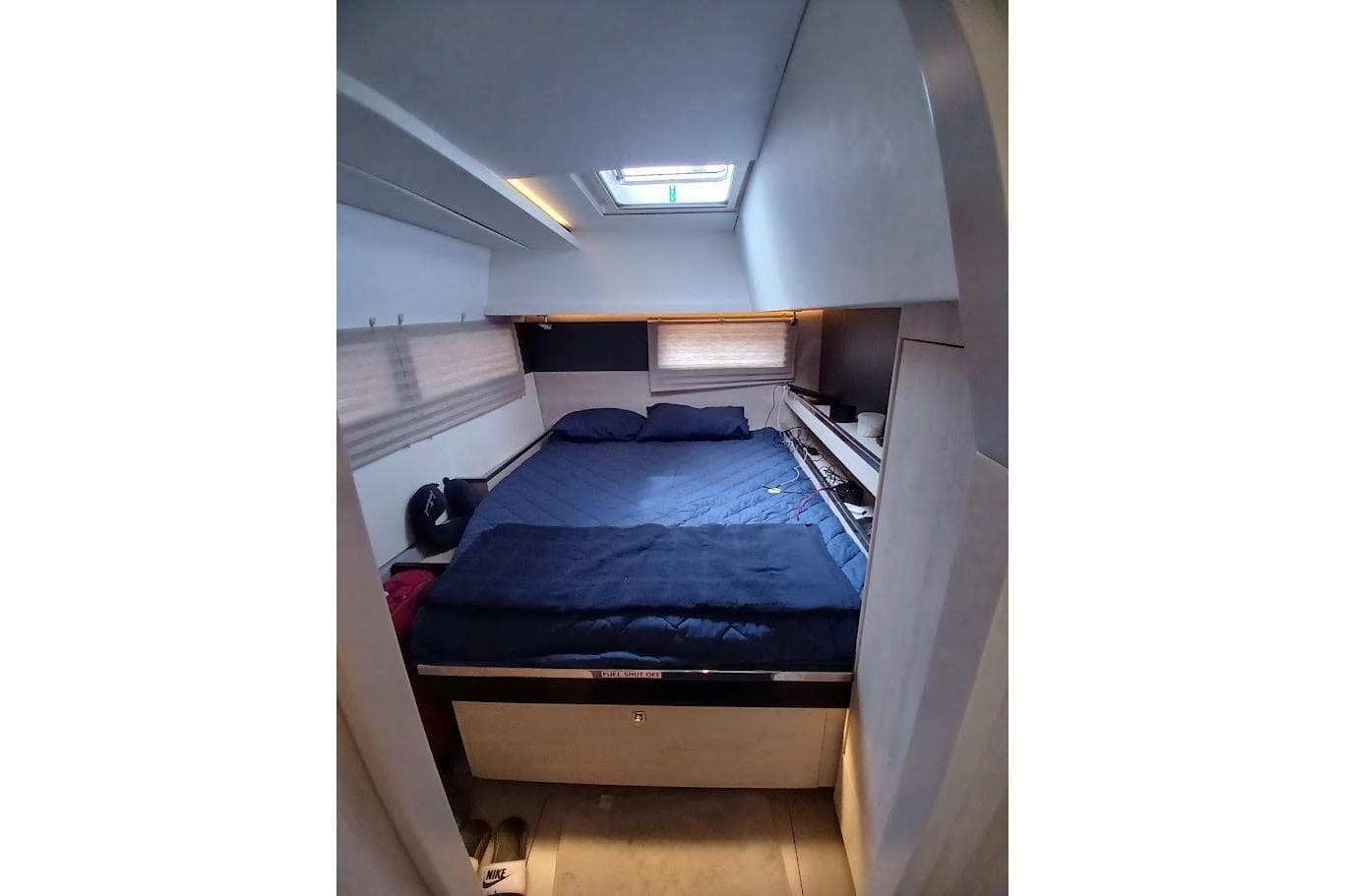 Cozy bedroom interior of 2019 Leopard 45 yacht with skylight and modern design.