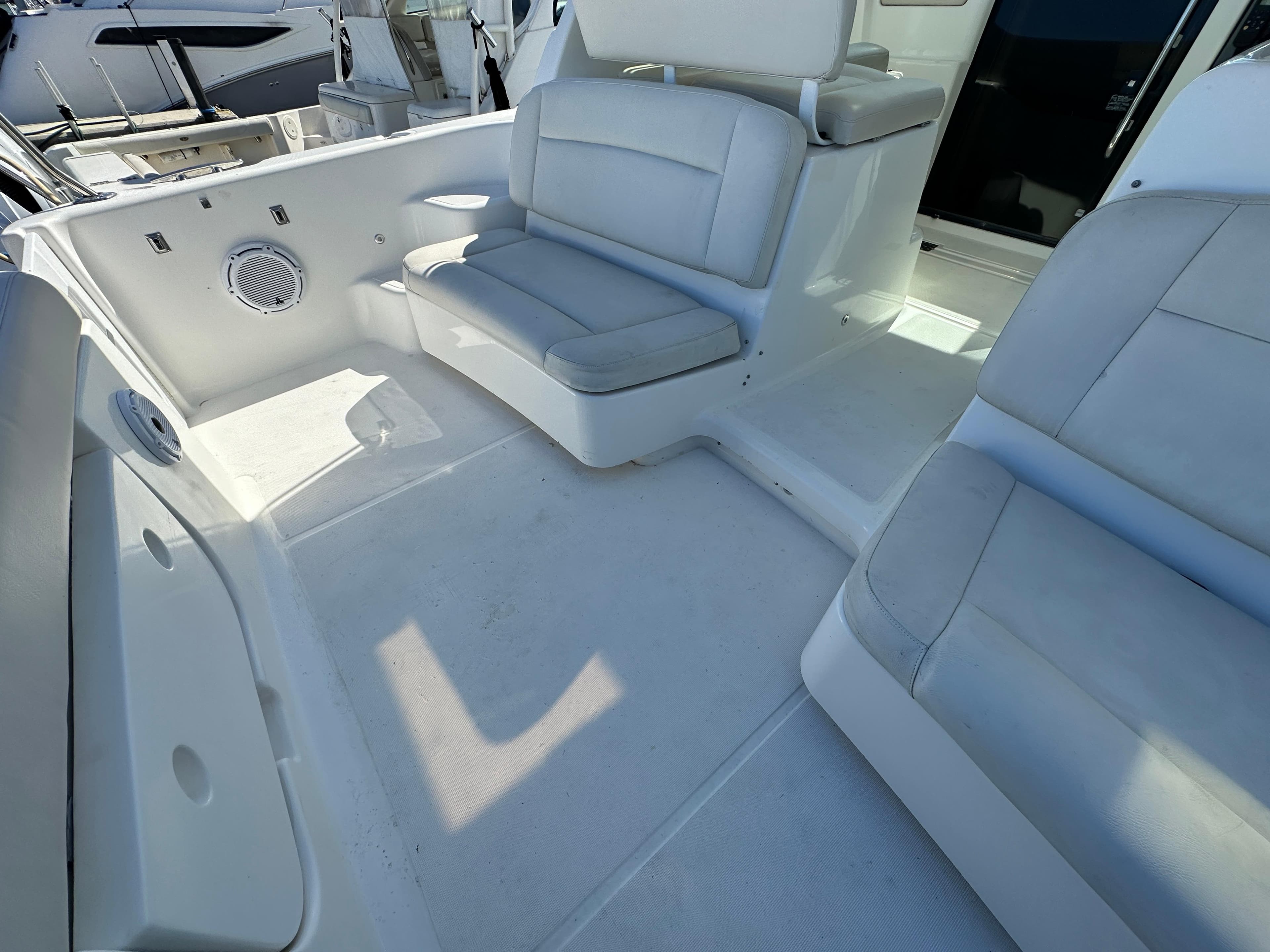 2004 Tiara Yachts 3600 Sovran cockpit seating area with white upholstery.