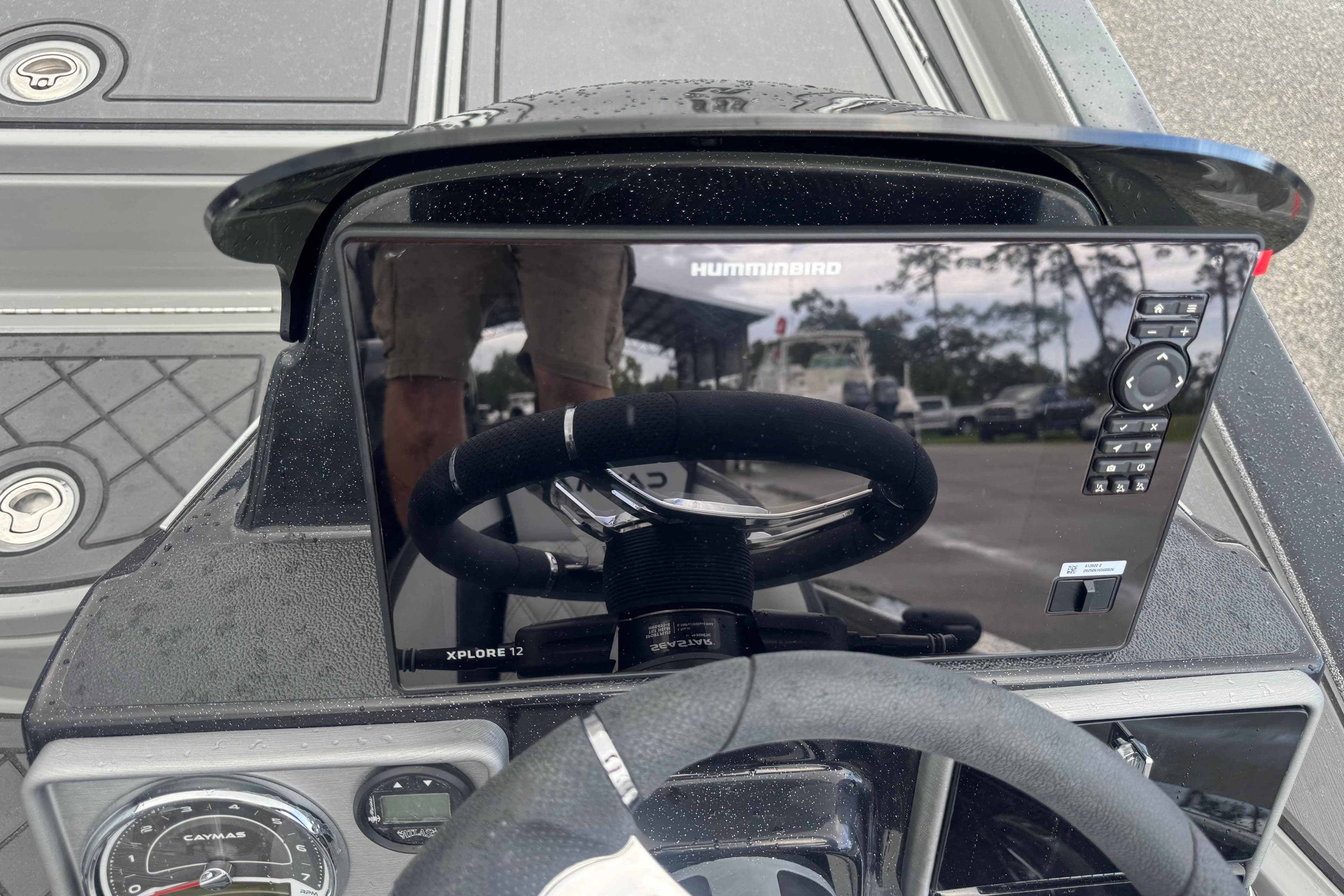 2026 Caymas XS 20 Pro boat dashboard with Humminbird Xplore 12 display and steering wheel.