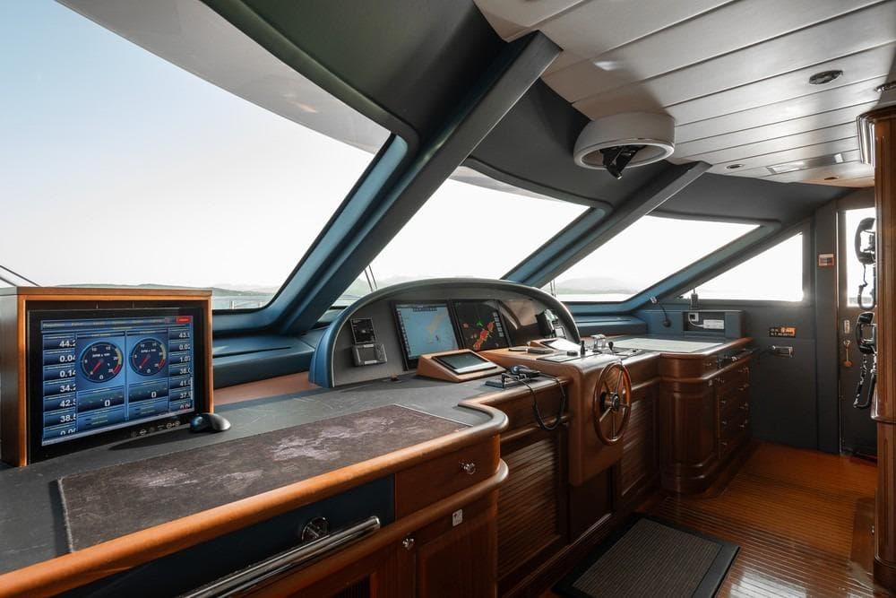 Pilothouse of 2008 Benetti Classic 120 yacht with navigation equipment and wooden interior.