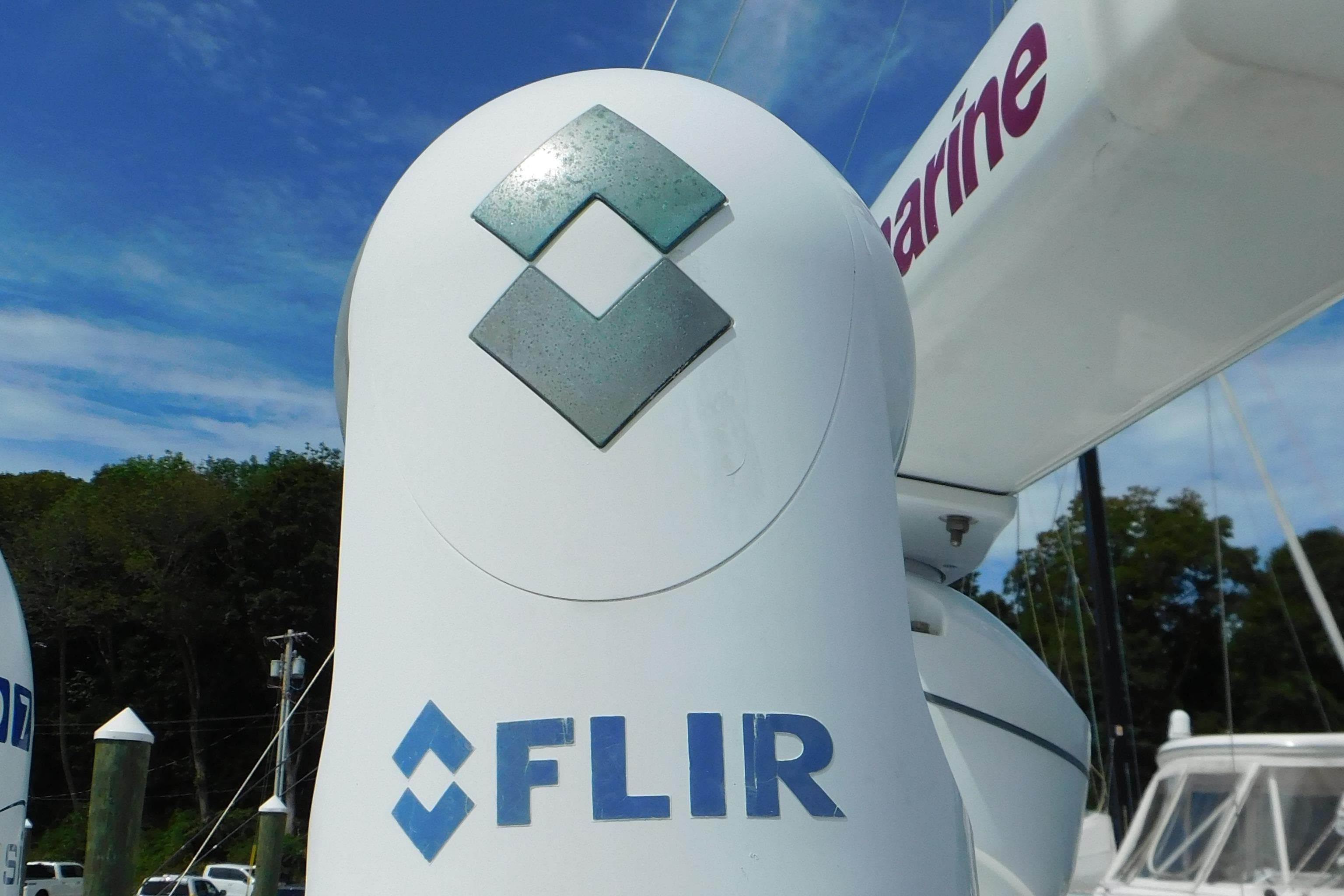 FLIR camera on 2013 Sea Ray 510 Sundancer yacht, docked with clear sky background.