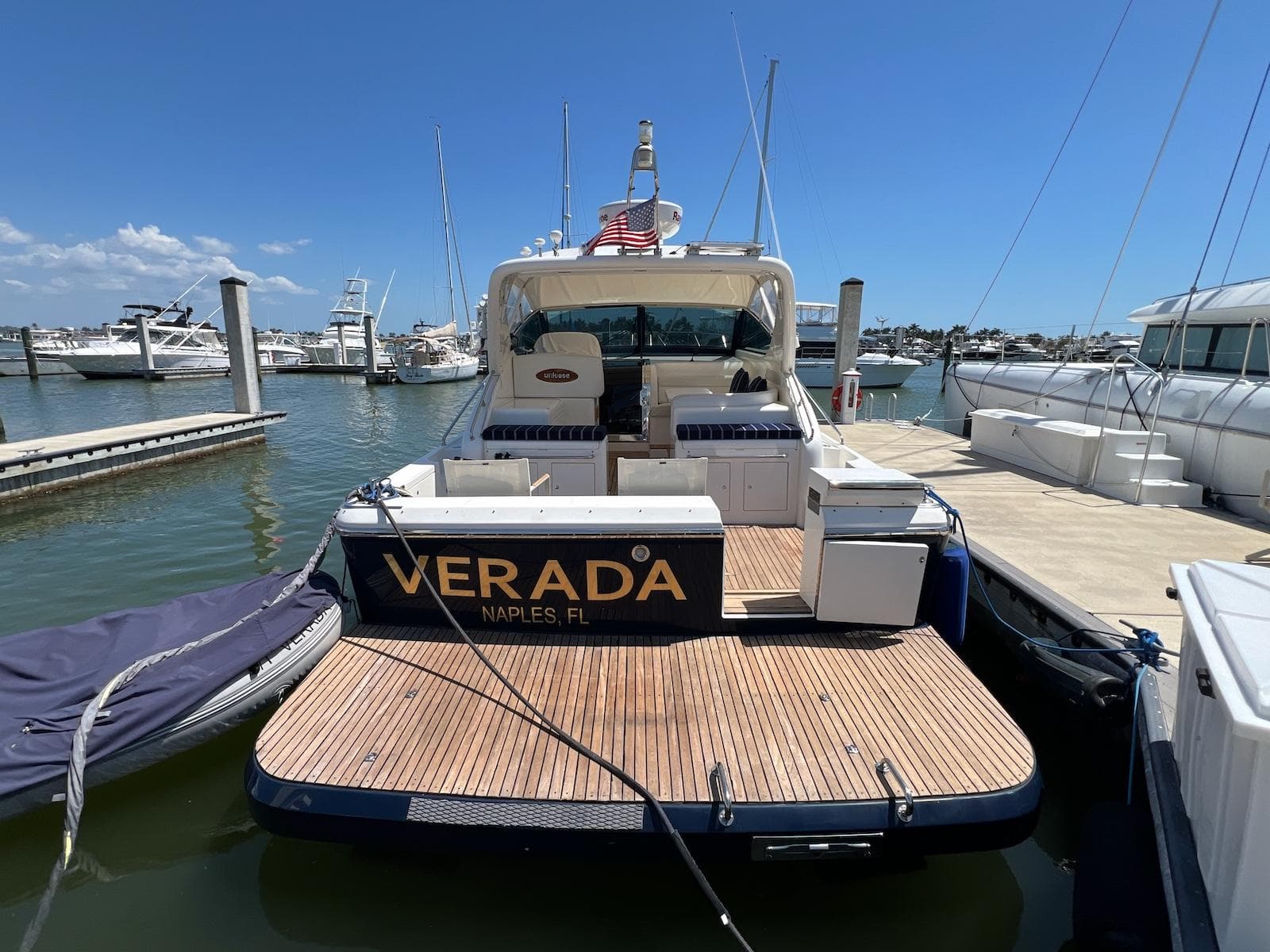 2001 Uniesse 42 Open yacht docked, rear view, with "VERADA" nameplate, Naples, FL.