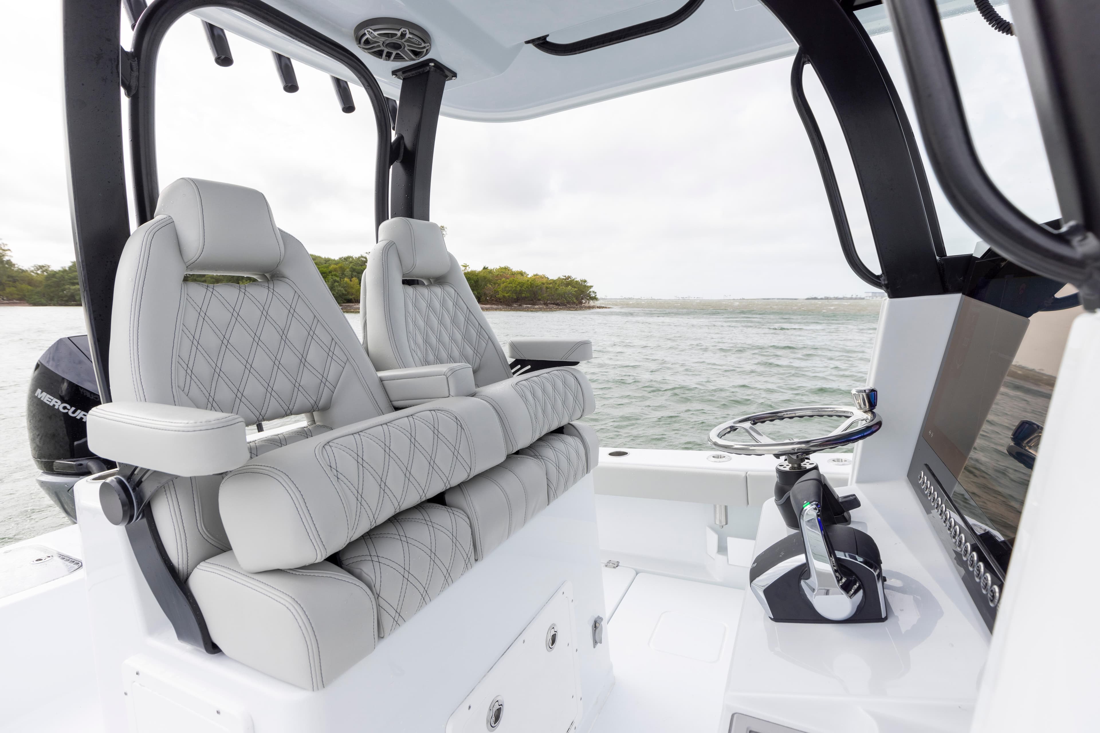 2024 Freeman 28 boat interior with luxury seating and modern controls.
