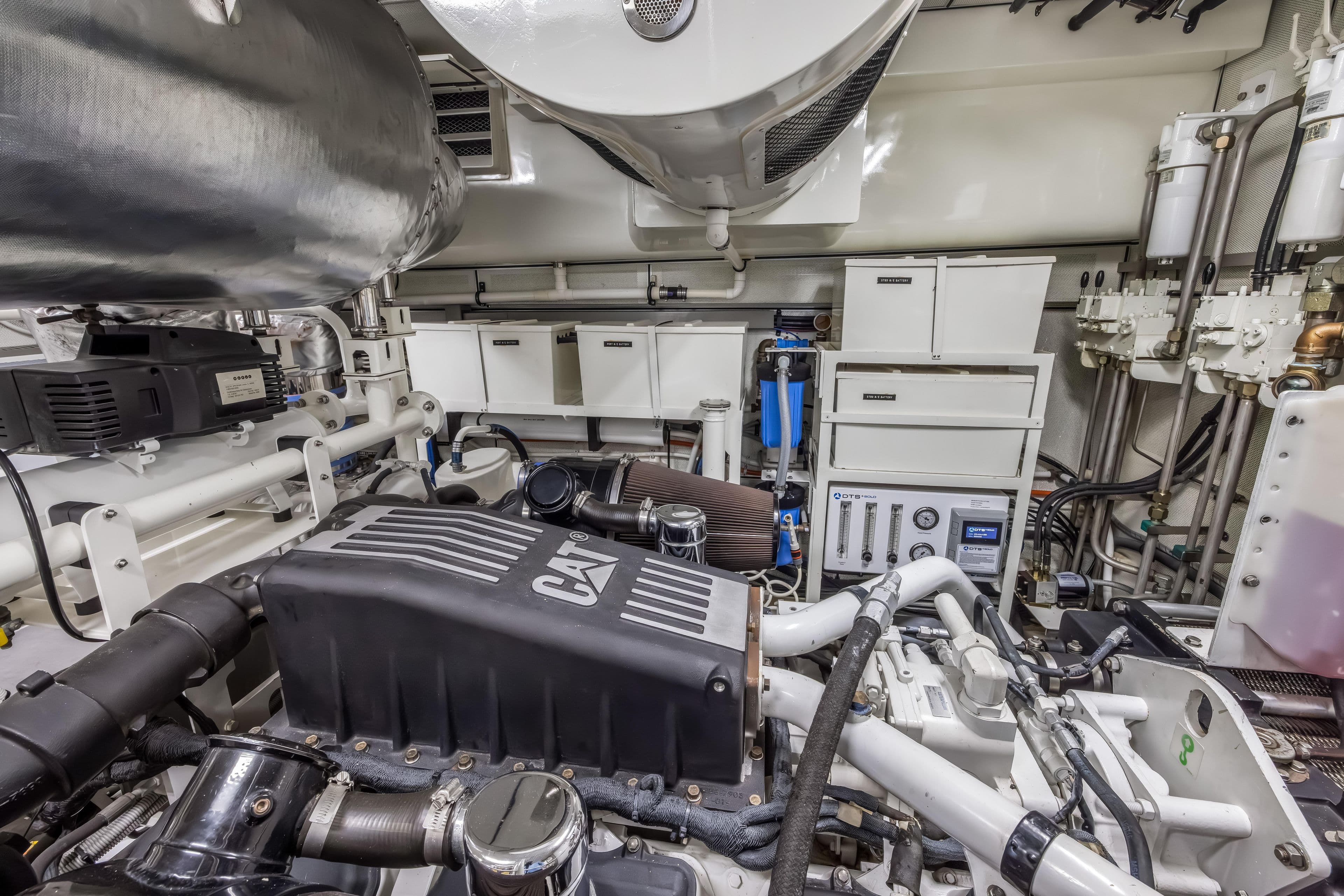 Engine room of a 2009 Cheoy Lee 78 yacht, featuring CAT machinery and advanced systems.