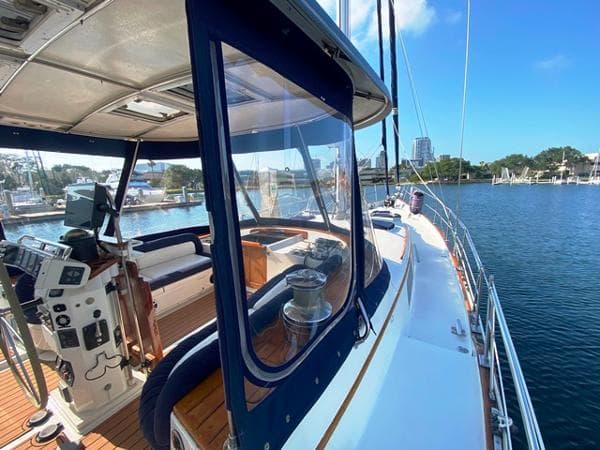 1989 Irwin 54 yacht deck with helm, seating, and marina view.