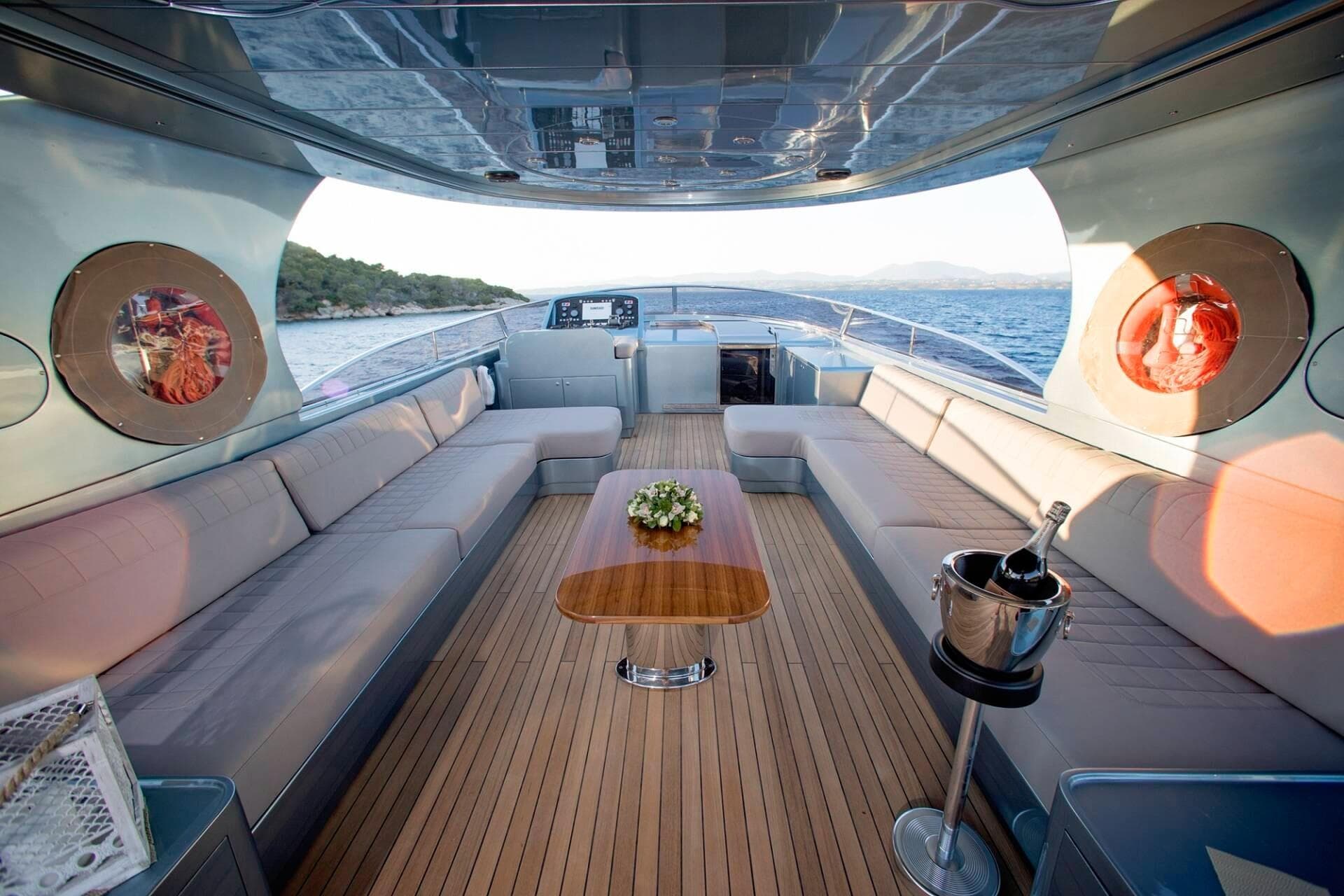 Luxurious 2006 Maiora 33DP yacht interior with elegant seating and ocean view.