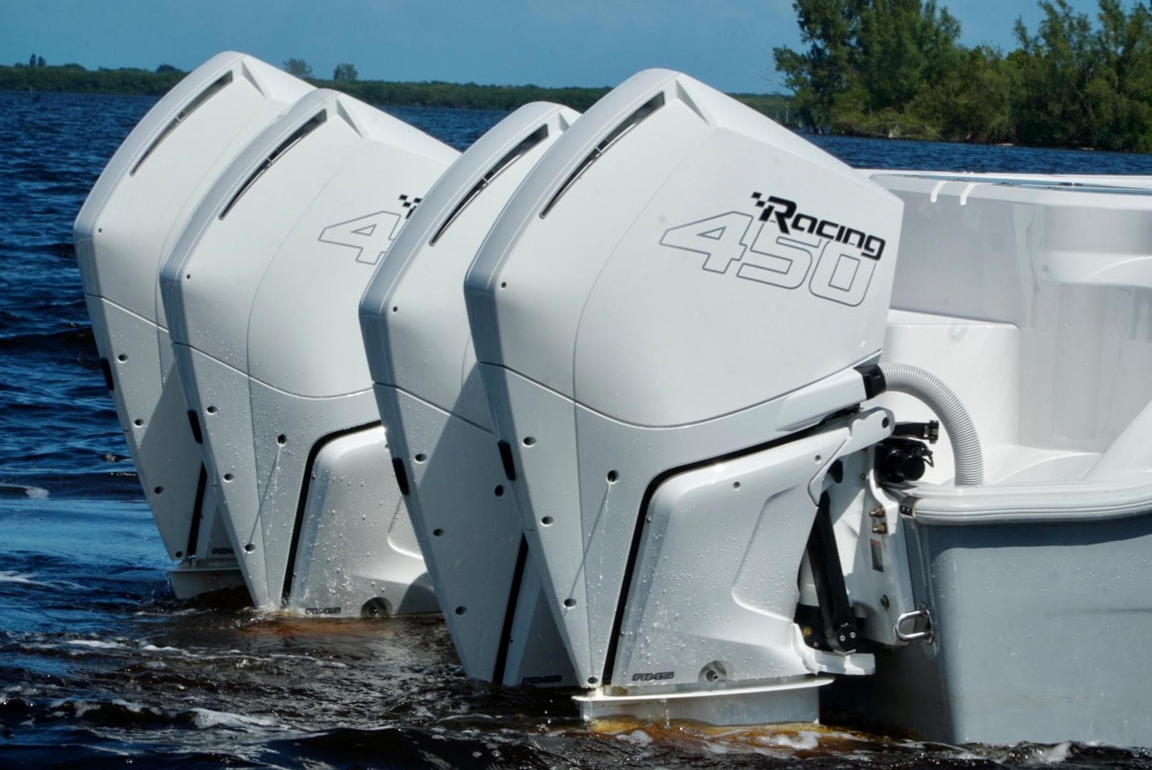 Triple outboard engines on a 2021 Invincible 46 Catamaran in water.