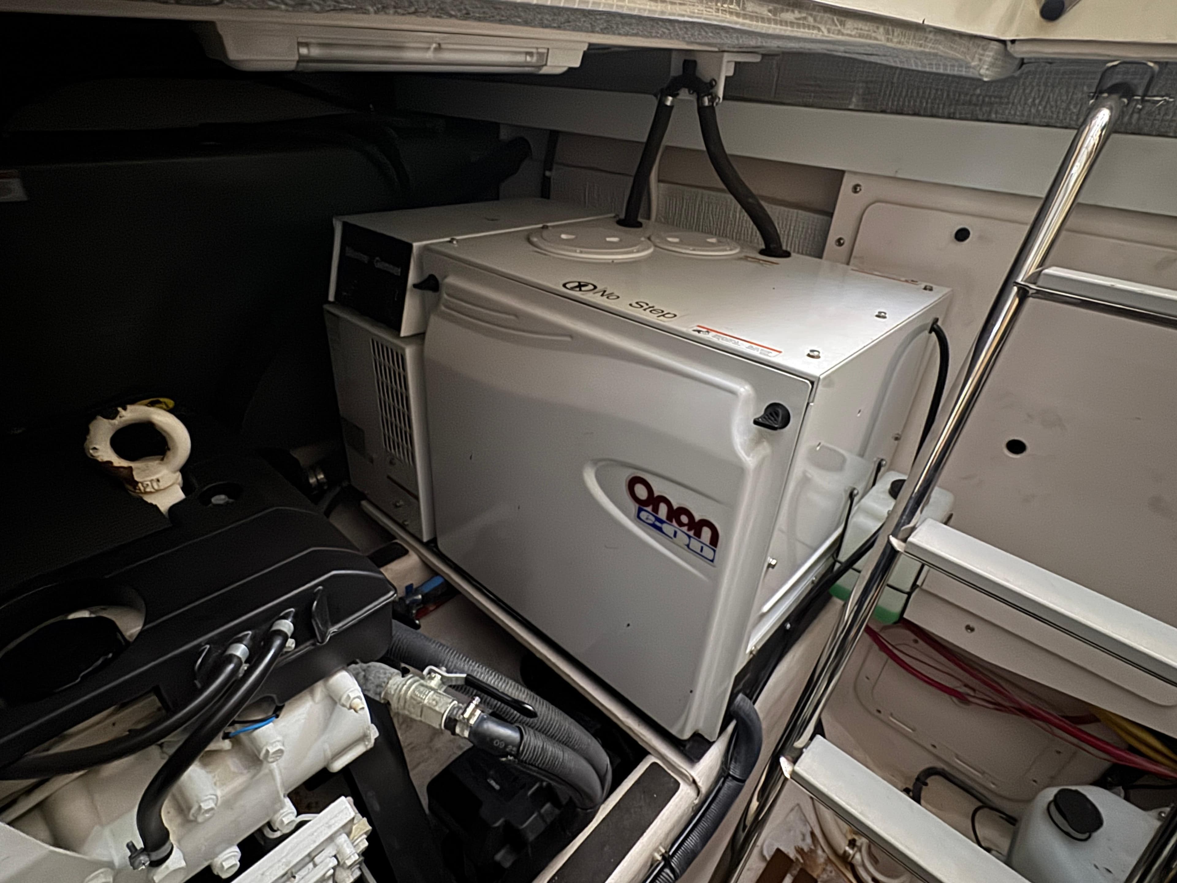 Engine room of 2008 Sabre 38 Hardtop Express with generator and mechanical components.