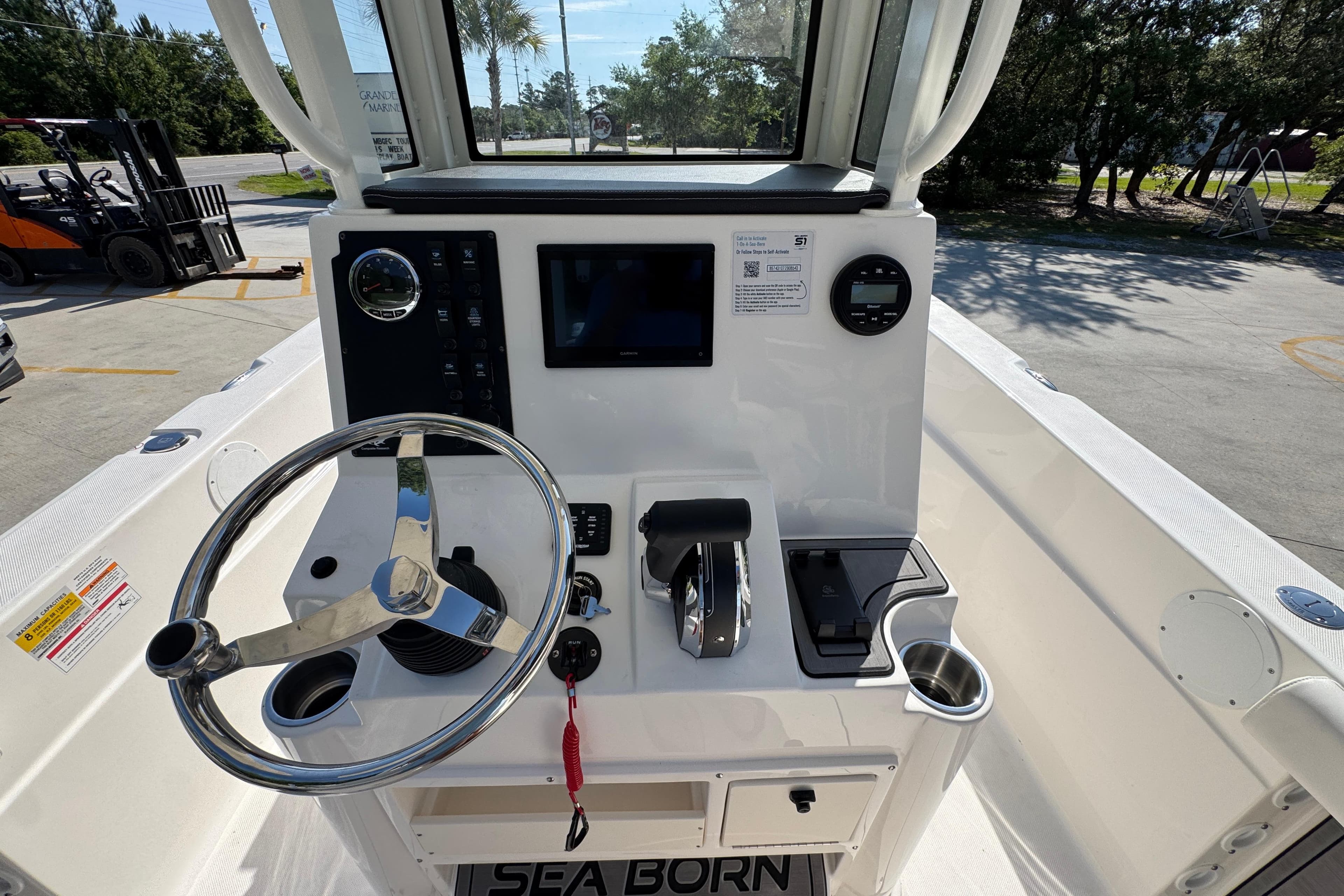 2027 Sea Born LX22 Center Console boat dashboard with steering wheel and controls.