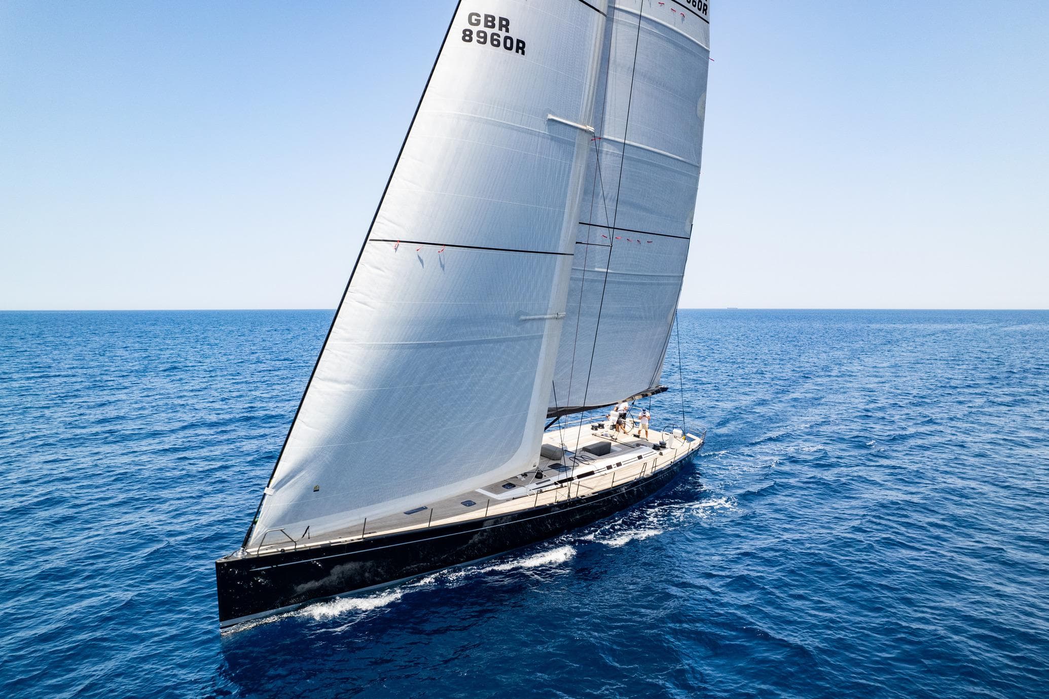 Nautor Swan 80 FD 2013 sailing yacht on open sea under clear sky.
