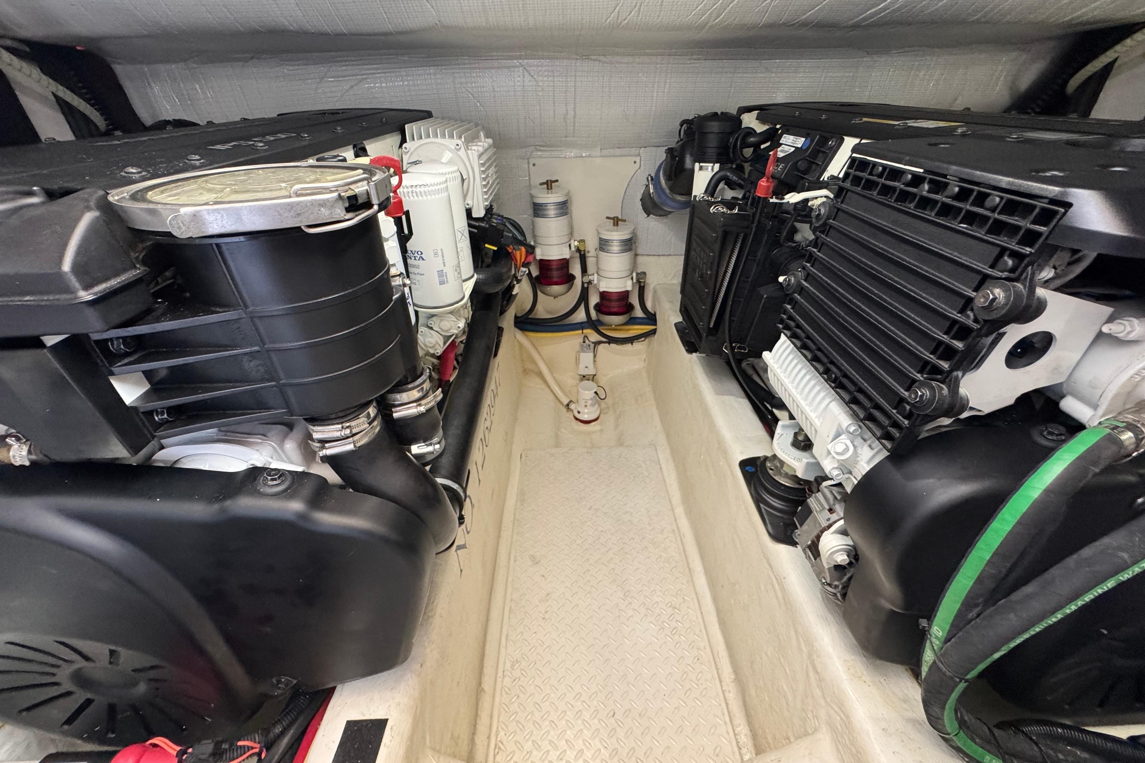 Engine room of 2016 Sabre Craft Salon Express, showcasing dual engines and components.