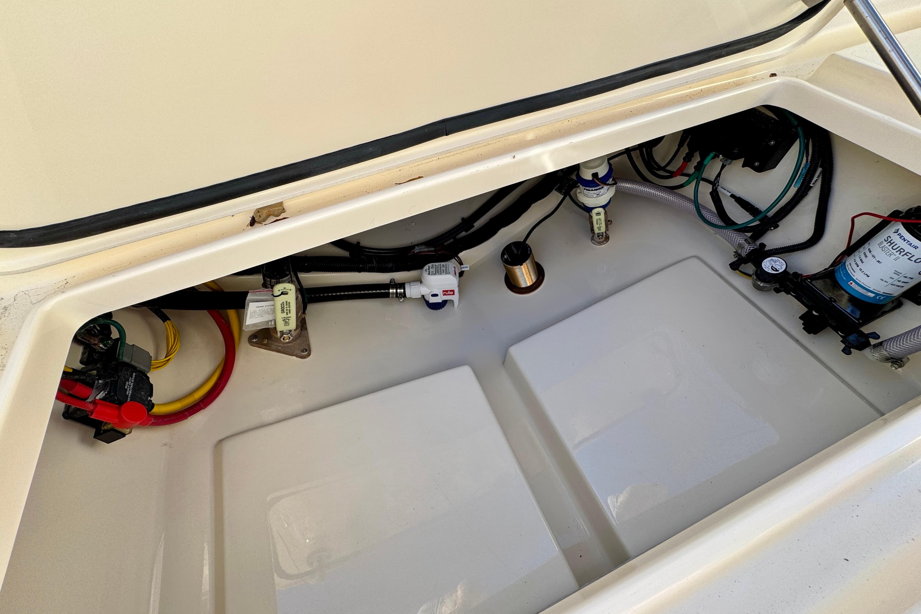 2026 Scout 240 XSF boat compartment with wiring and components visible.