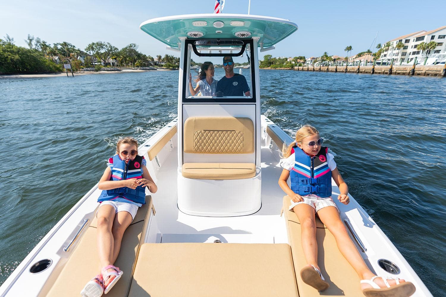 Manufacturer Provided Image: 2025 Sportsman Masters 227 Bay Boat cruising with family on sunny day.