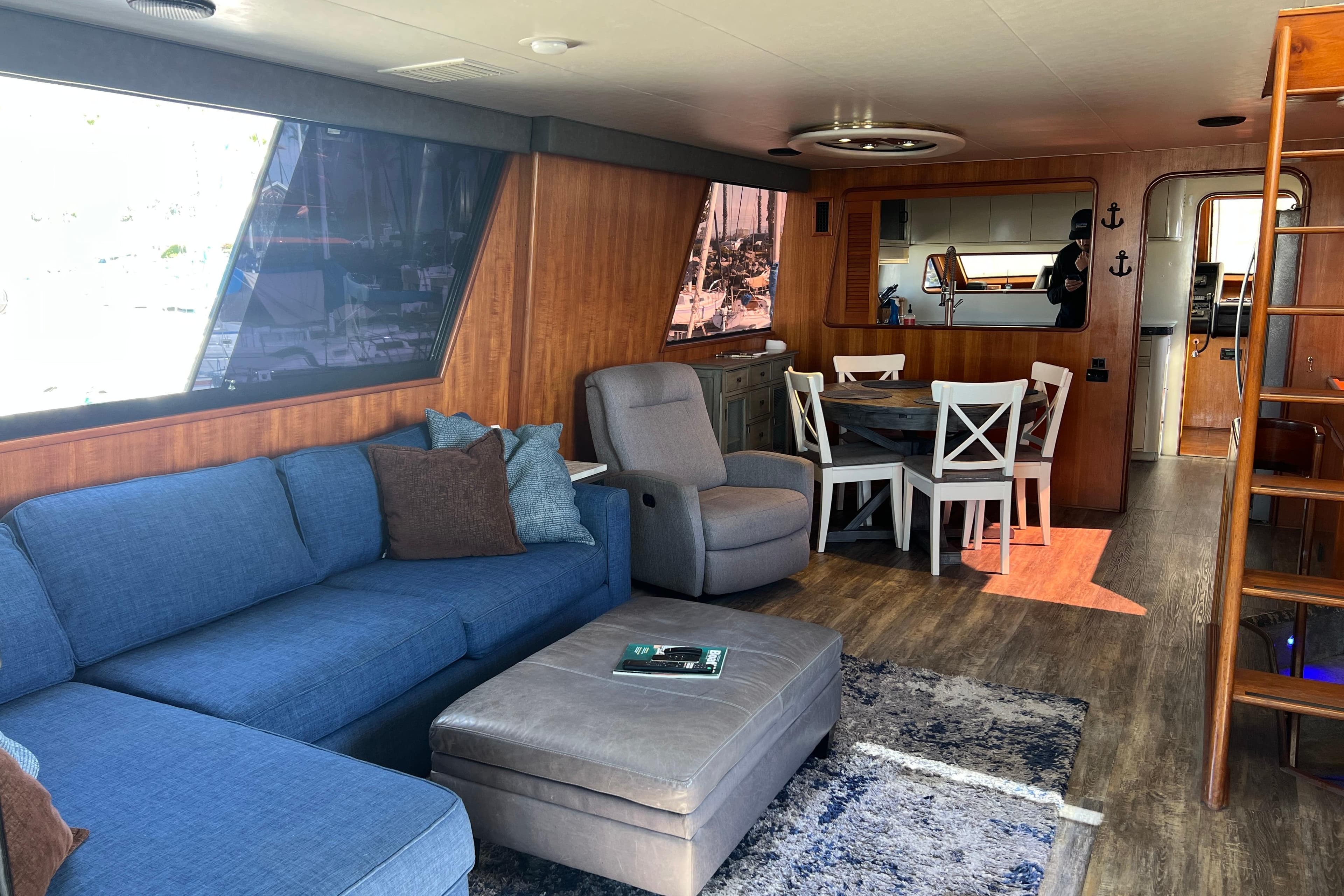 Luxurious interior of 1991 Viking 63 Motor Yacht with modern furnishings and wooden accents.