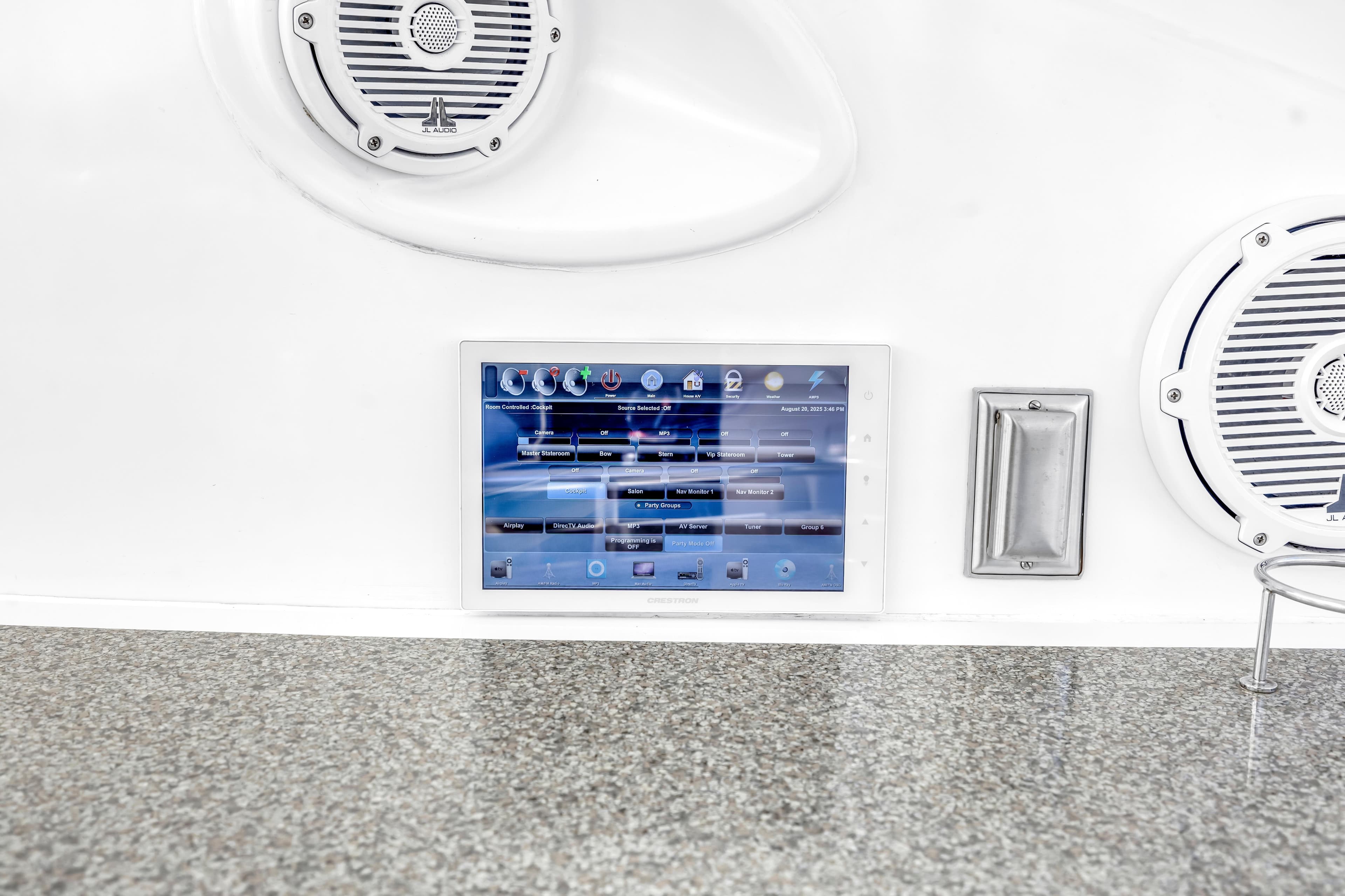Control panel and speakers on a 2002 Cruisers 5370 yacht dashboard.