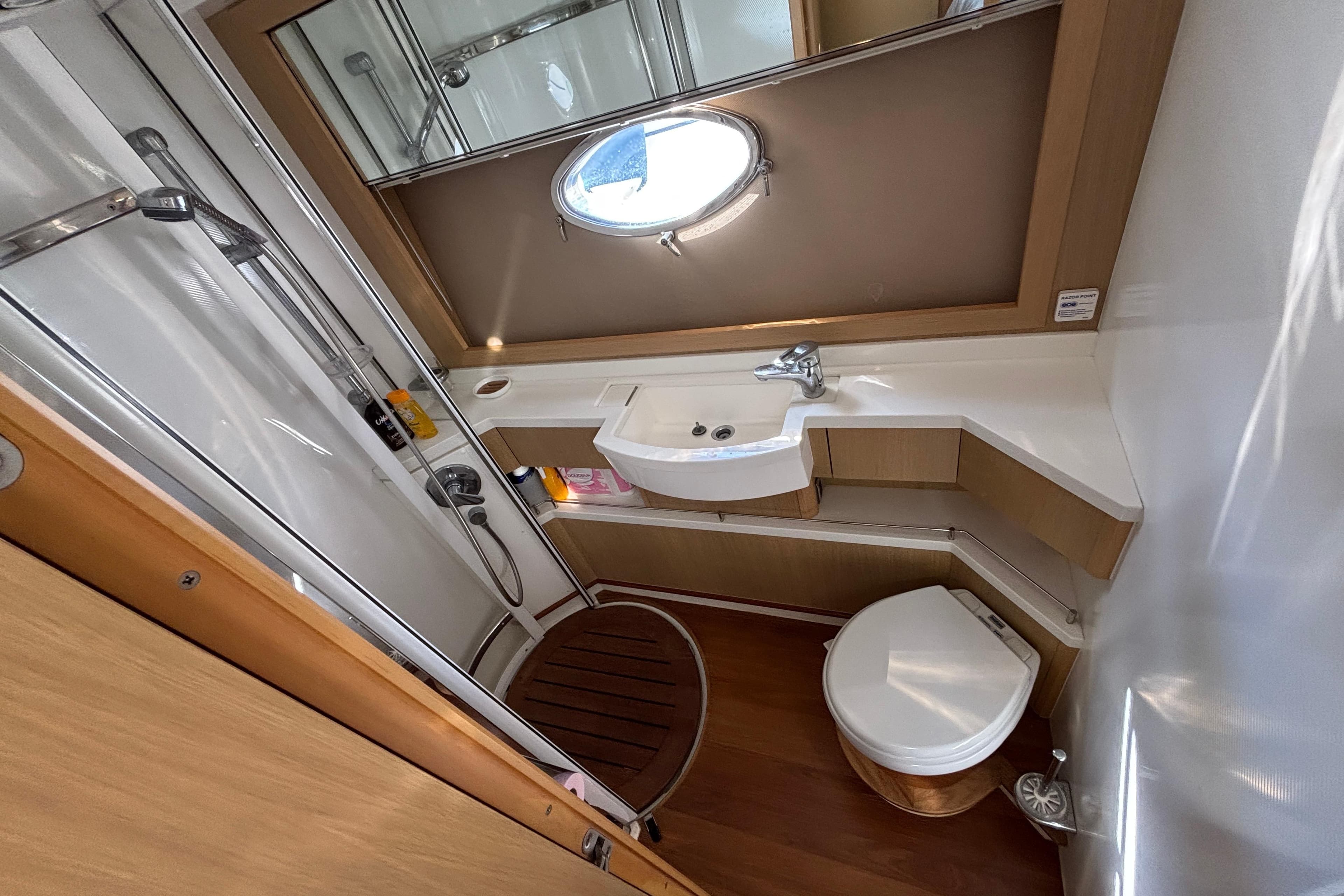 Luxurious 2008 Princess V53 yacht bathroom with modern fixtures and wooden accents.