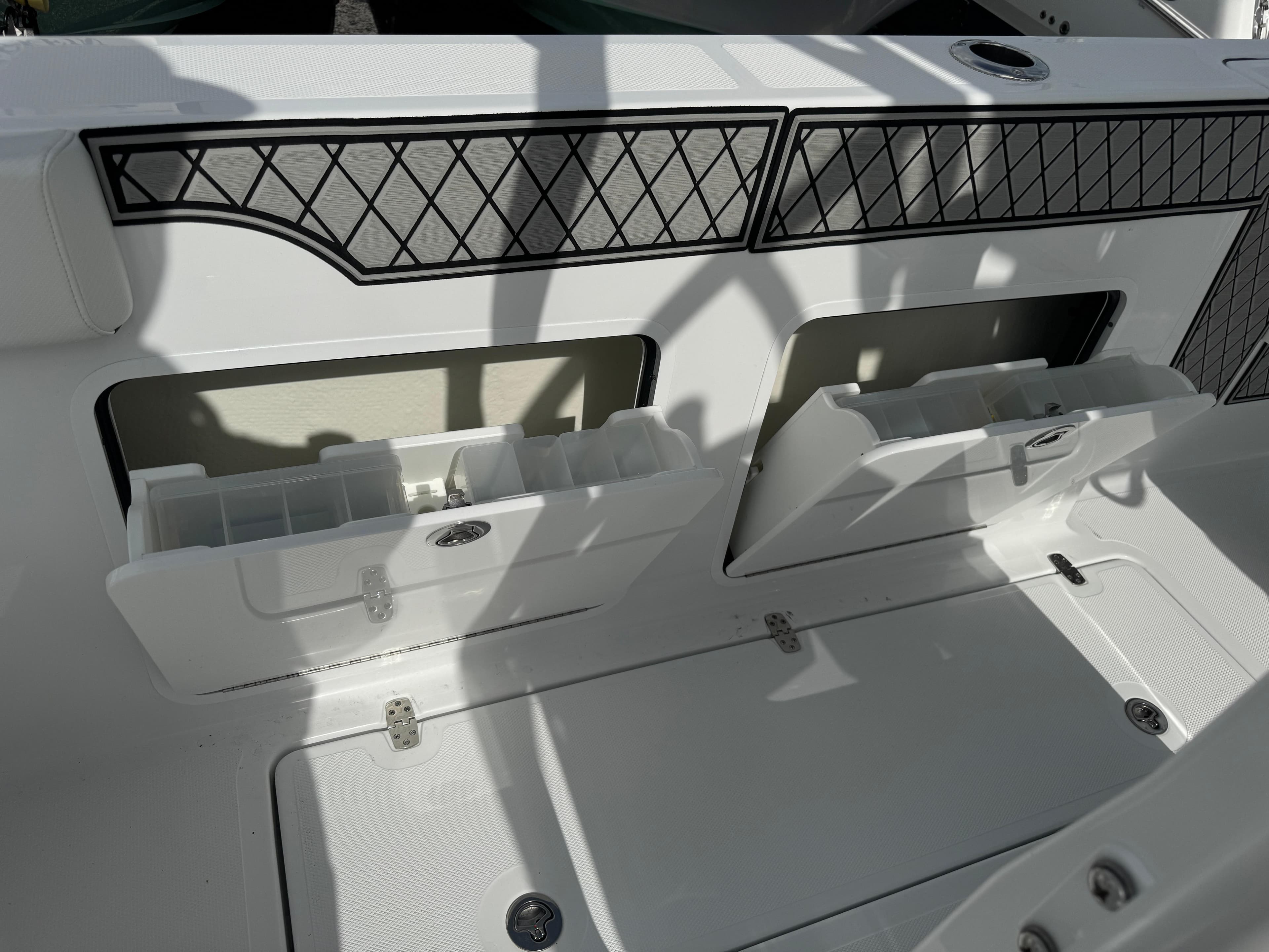 2025 Wellcraft 302 Fisherman boat storage compartments with sleek design and practical features.