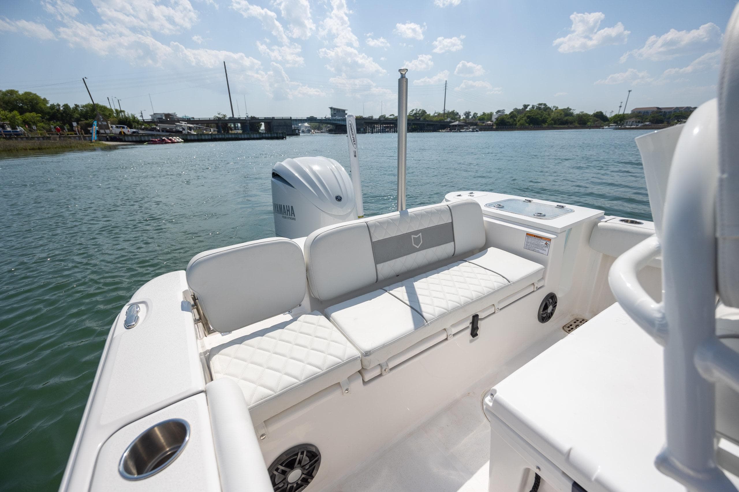 2025 Sea Fox 228 Commander boat interior with Yamaha engine, docked on a sunny day.
