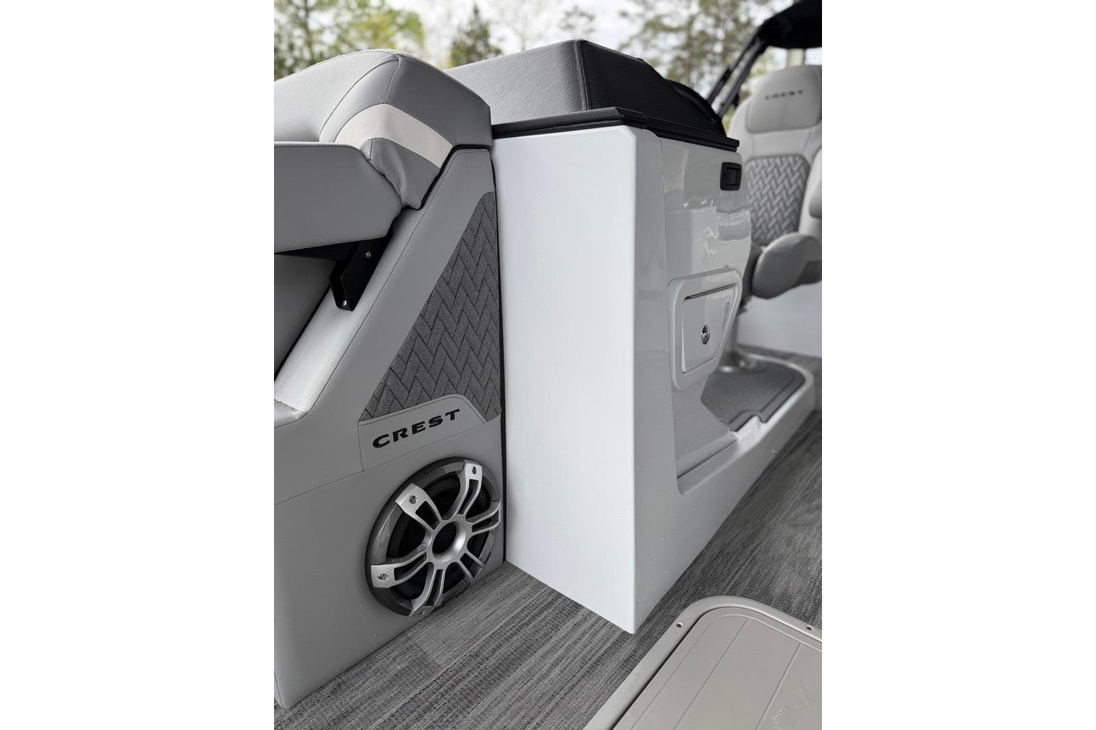 Interior of 2026 Crest Caribbean 250 SLRC boat, featuring sleek seating and speaker system.