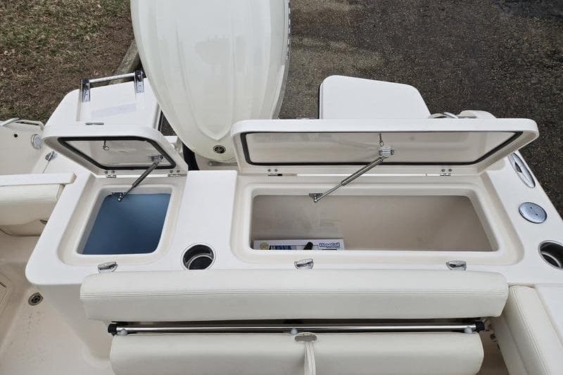 2026 Grady-White Fisherman 236 boat with open storage compartments and seating.