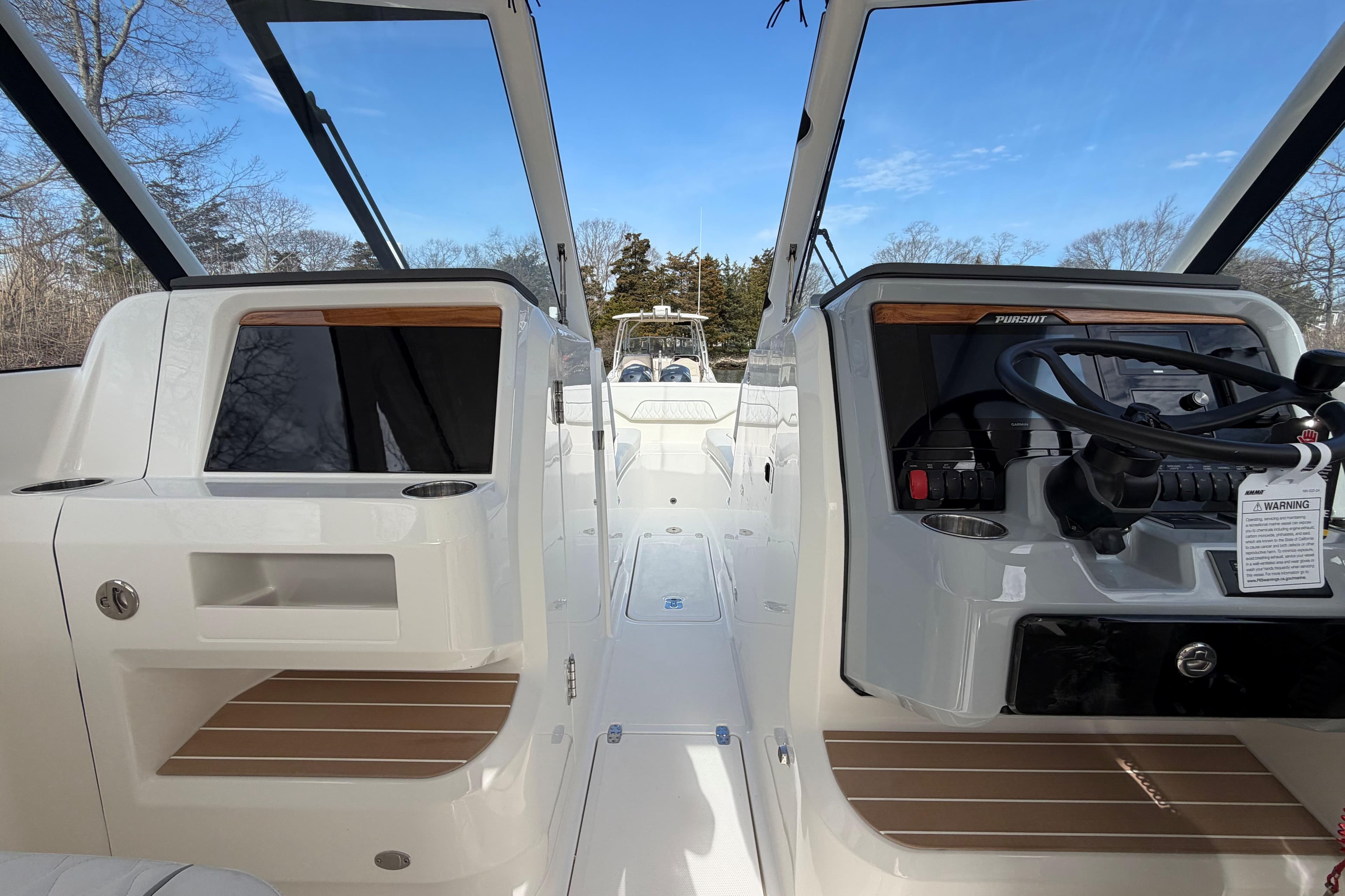 2026 Pursuit DC 286 Dual Console boat interior with steering wheel and dashboard view.